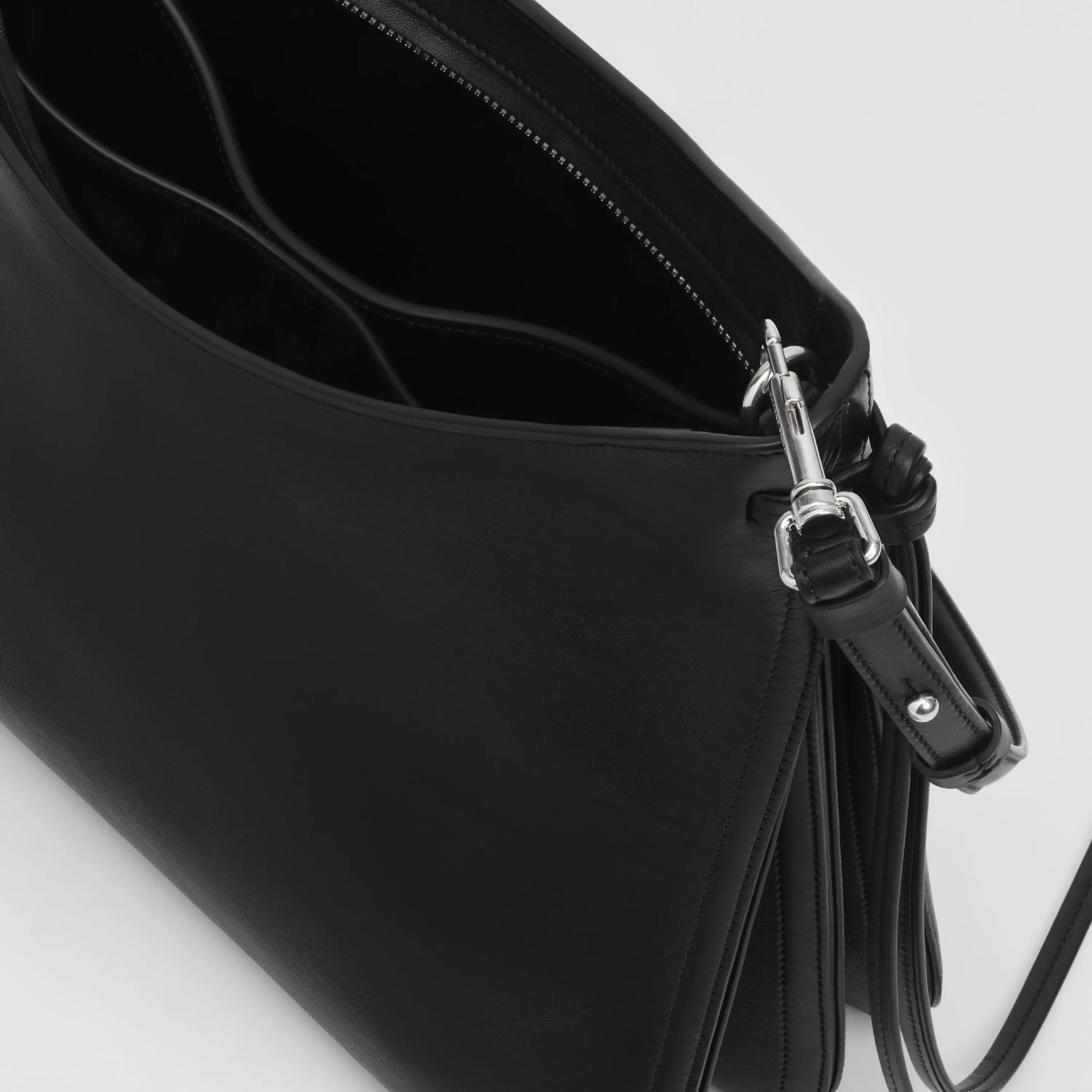 Close up detail view of gig bag in black leather