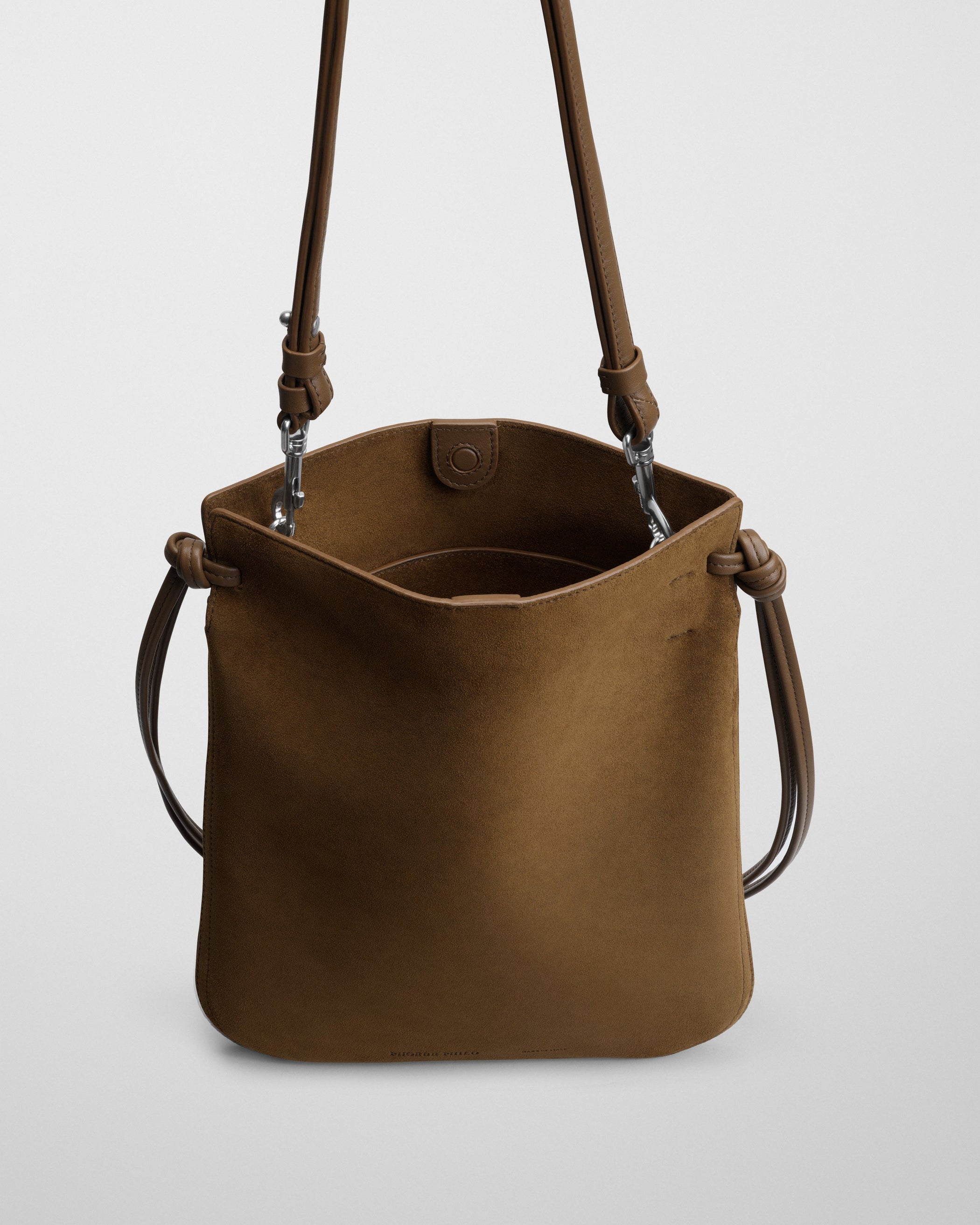 Close up detail view of GIG POUCH BAG in toffee suede