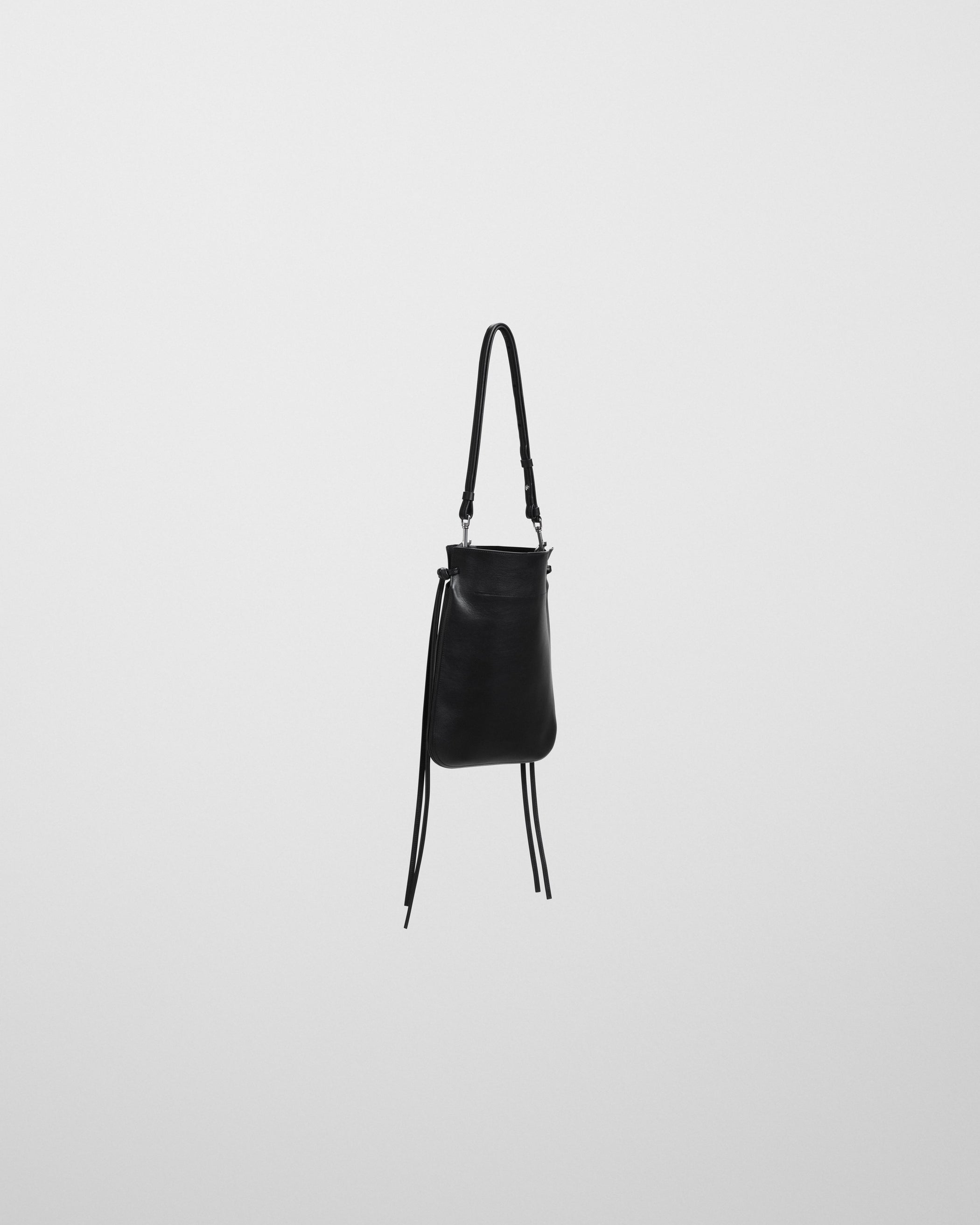 Side view of GIG POUCH in black leather