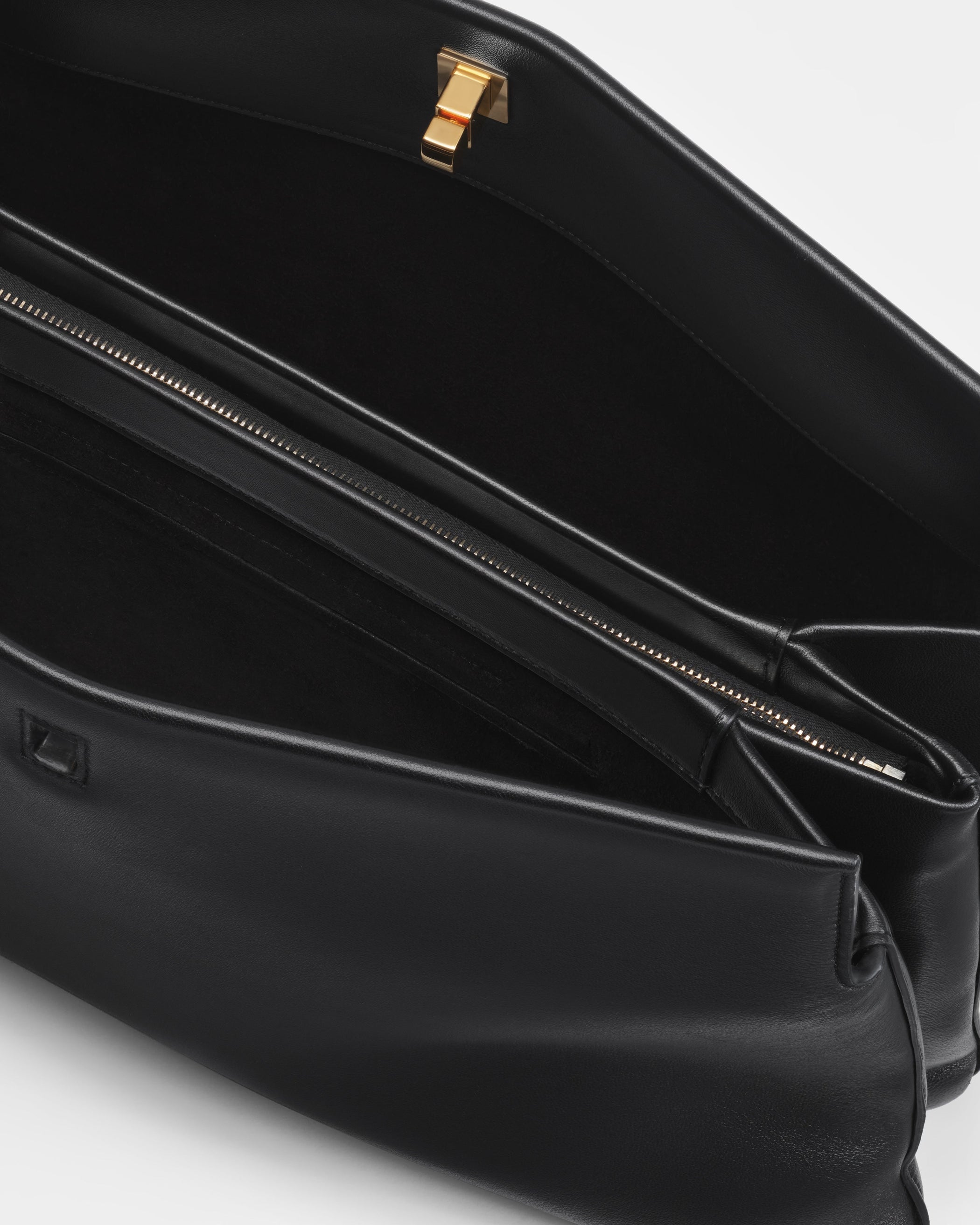 Close up detail view of TRIPLEX CLUTCH BAG in black leather