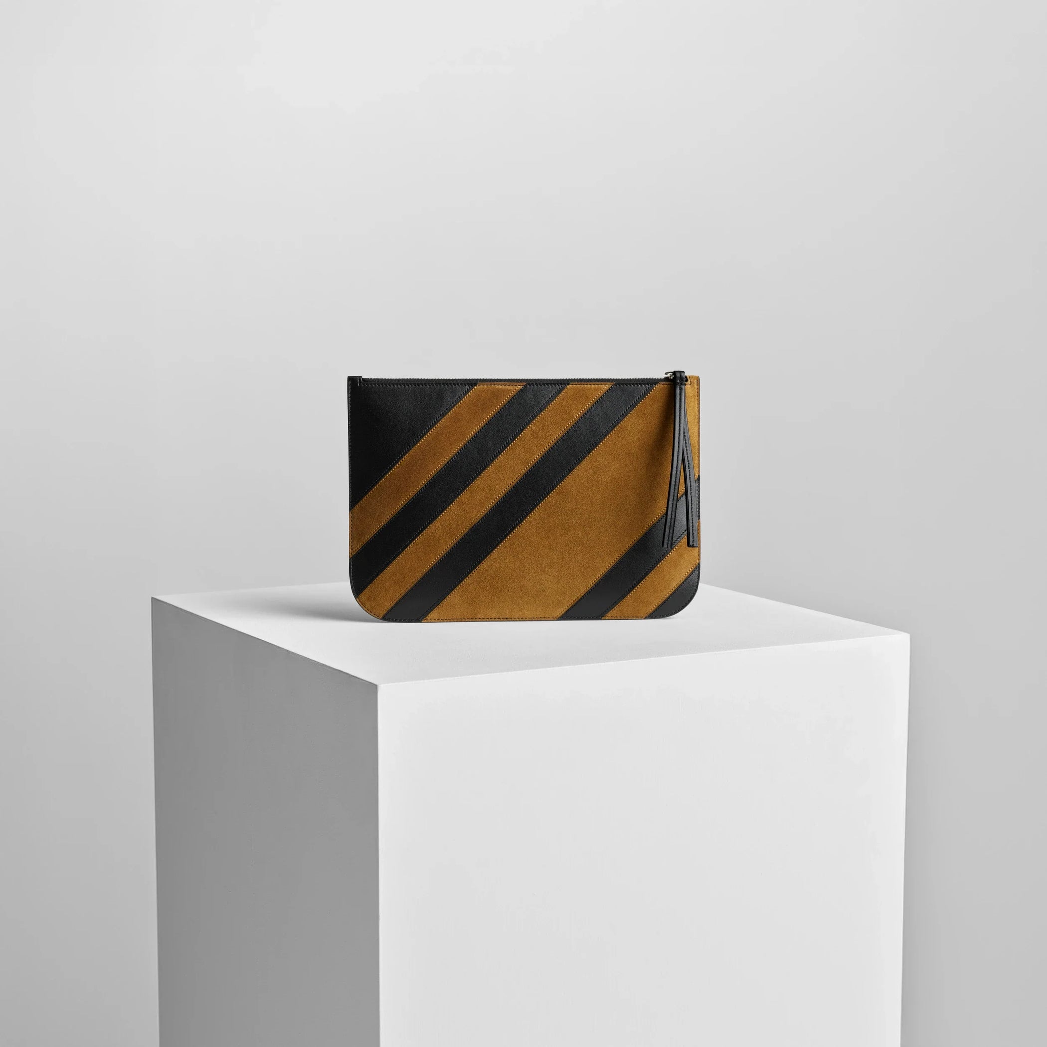 Back view of pocket pouch in toffee/black leather.