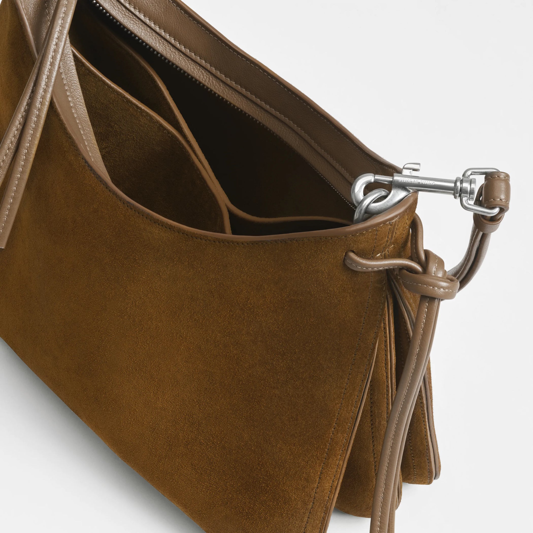 Close up detail view of small gig in toffee suede.
