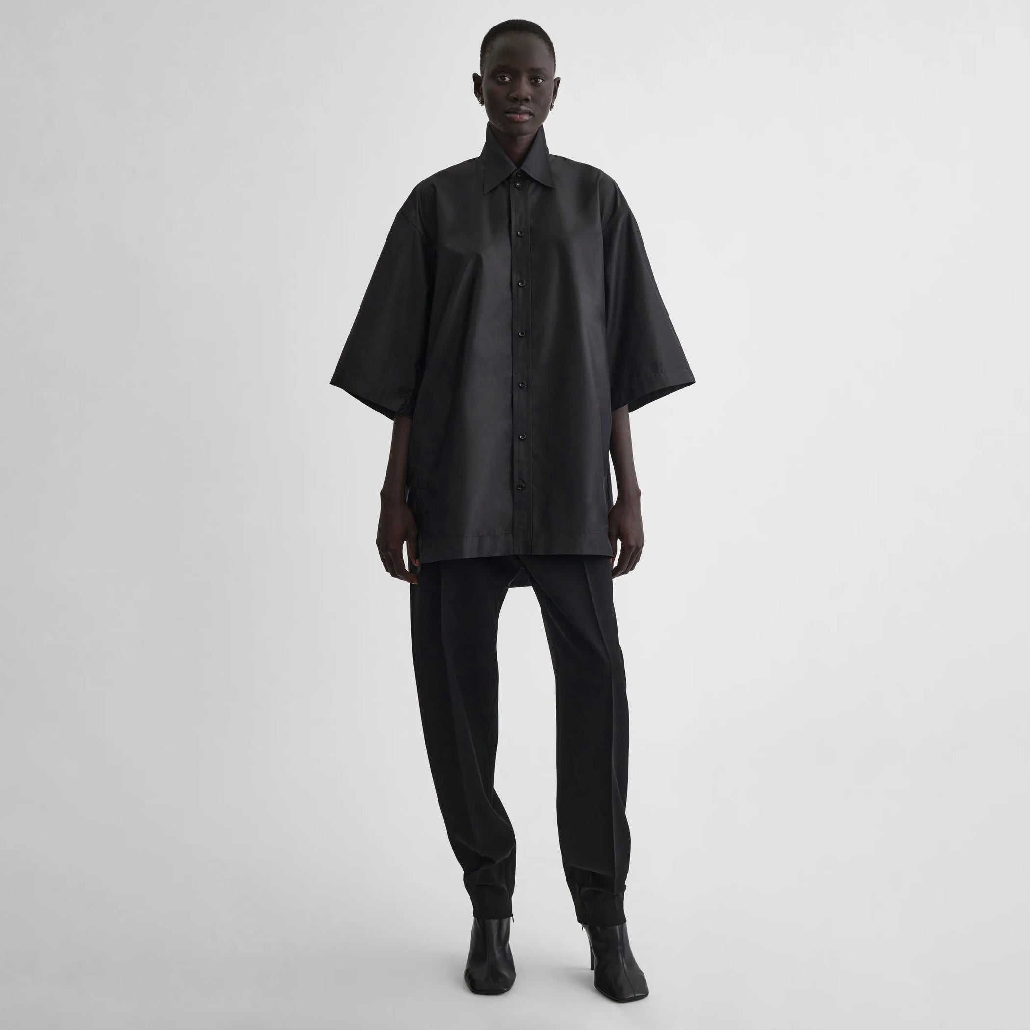 Front view of short sleeve shirt in black technical taffeta