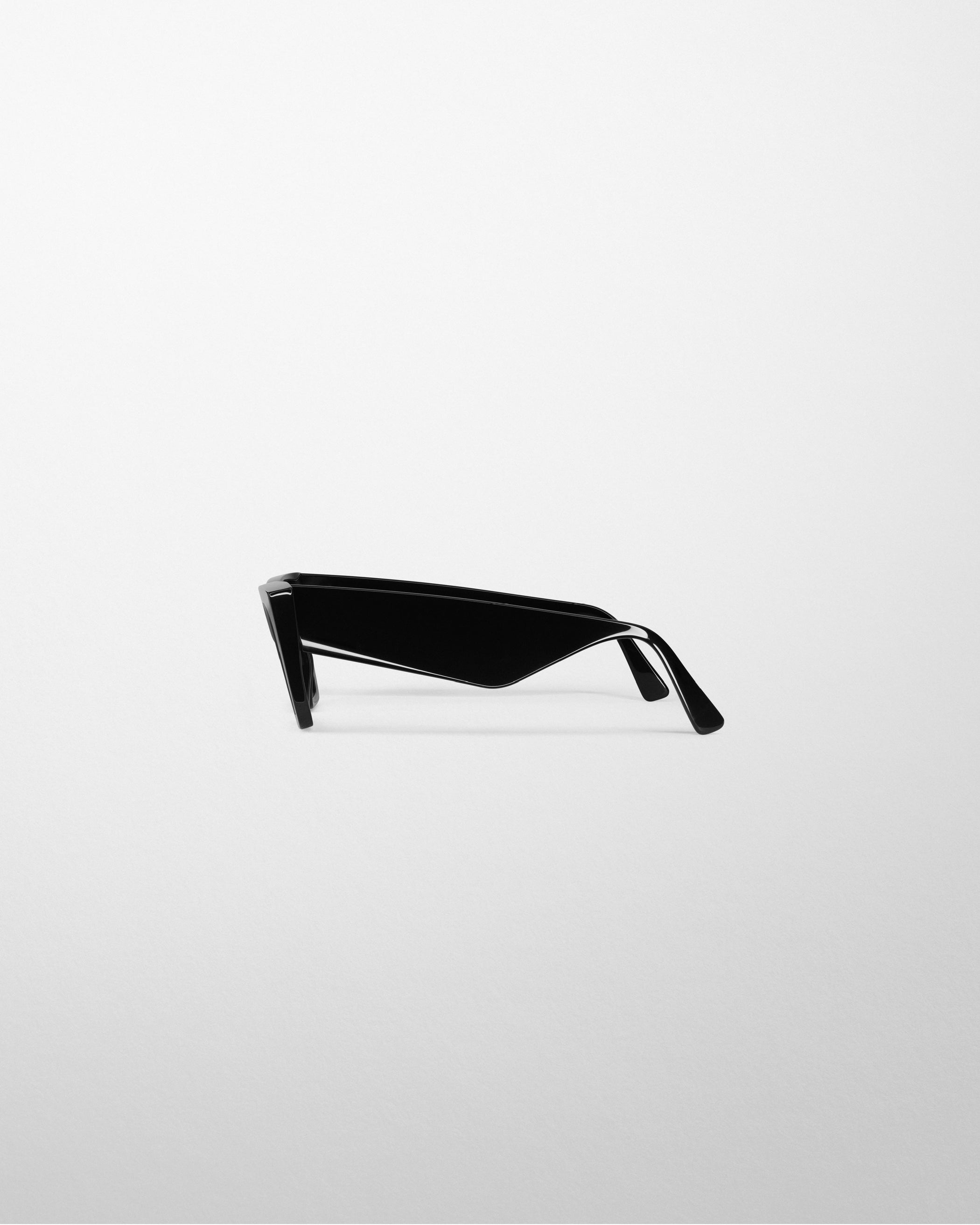 Side view of PEAK SUNGLASSES in black acetate
