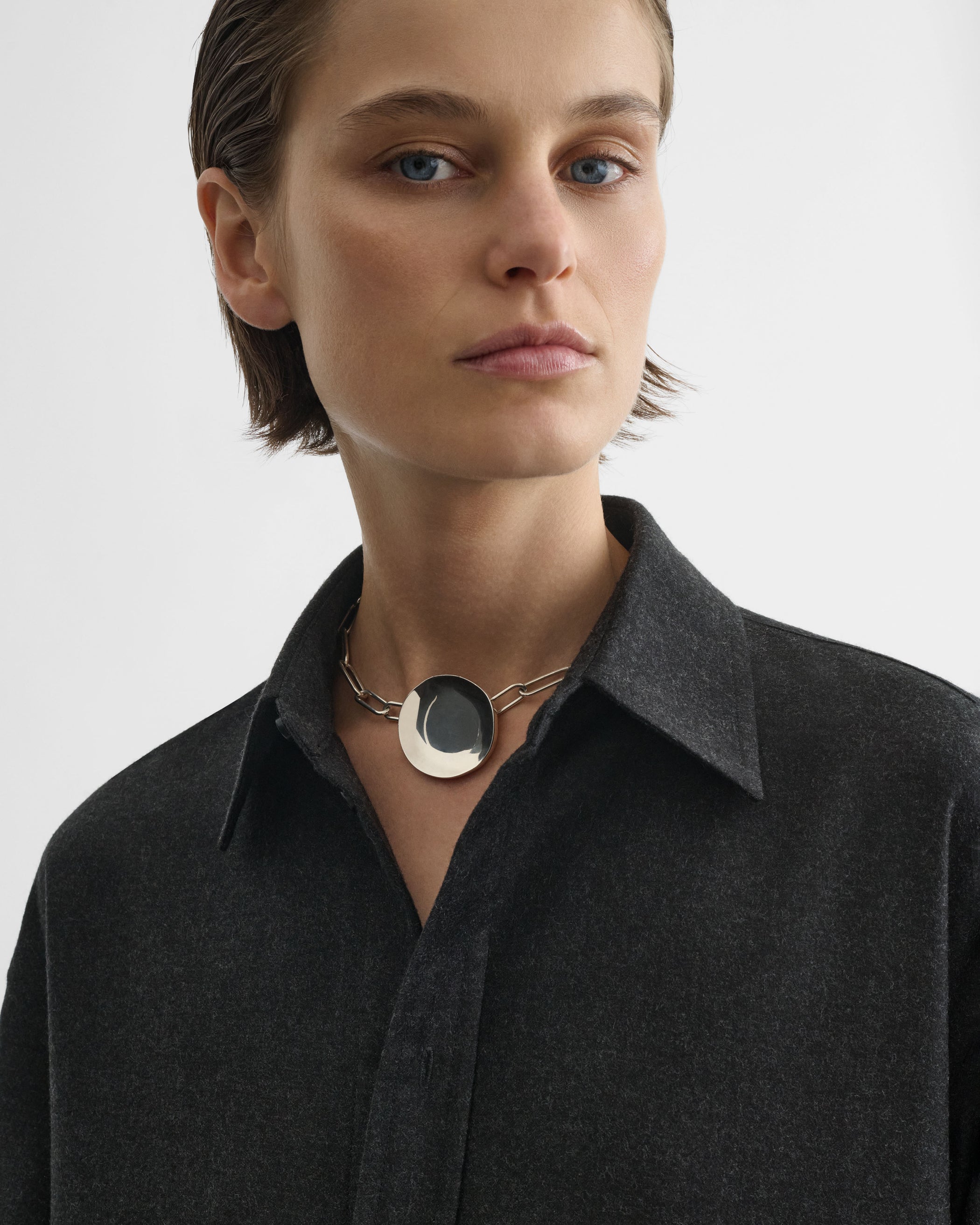 Front view of model wearing MEDALLION NECKLACE in sterling silver