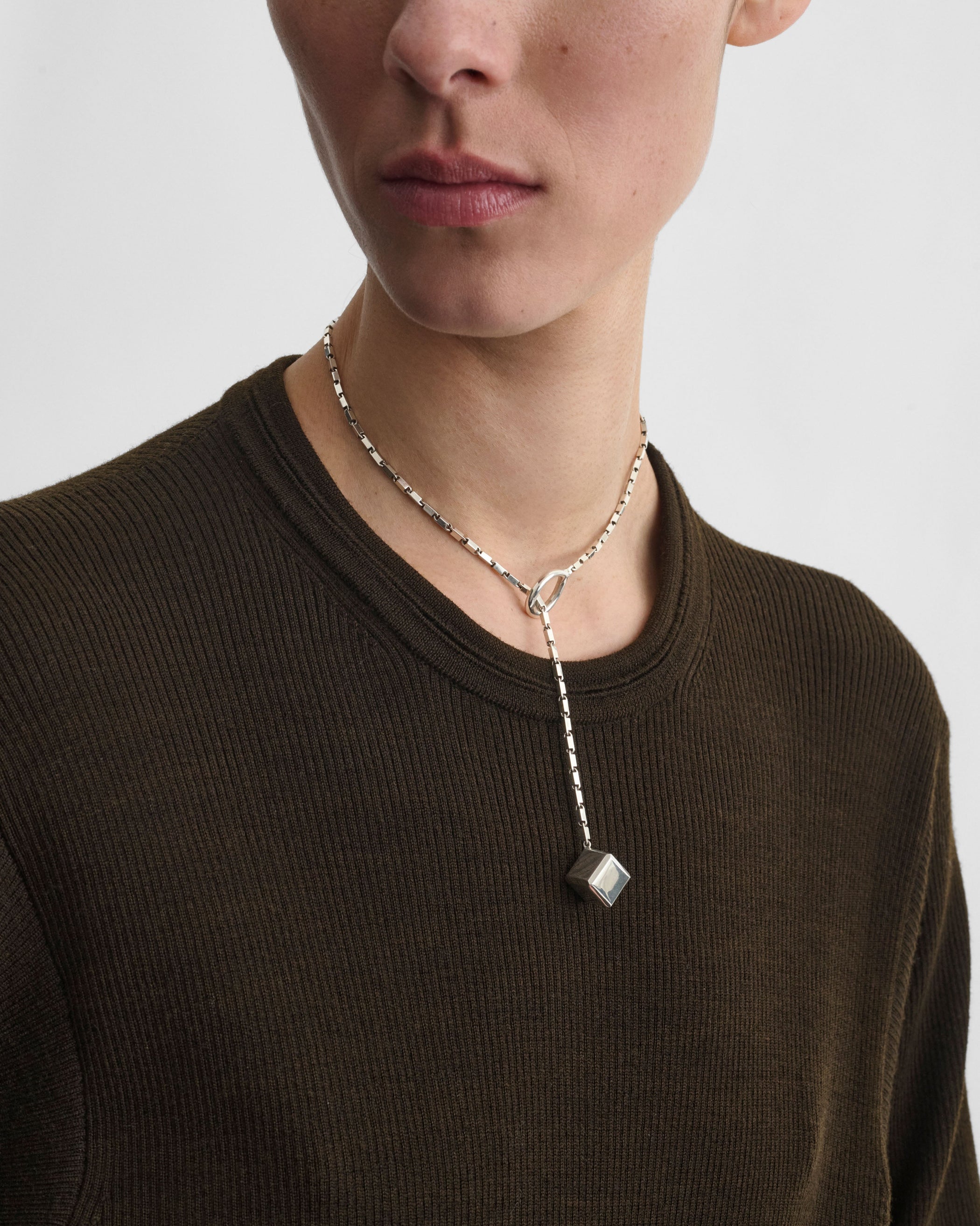 Front view of model wearing HOOP TIE PENDANT in sterling silver