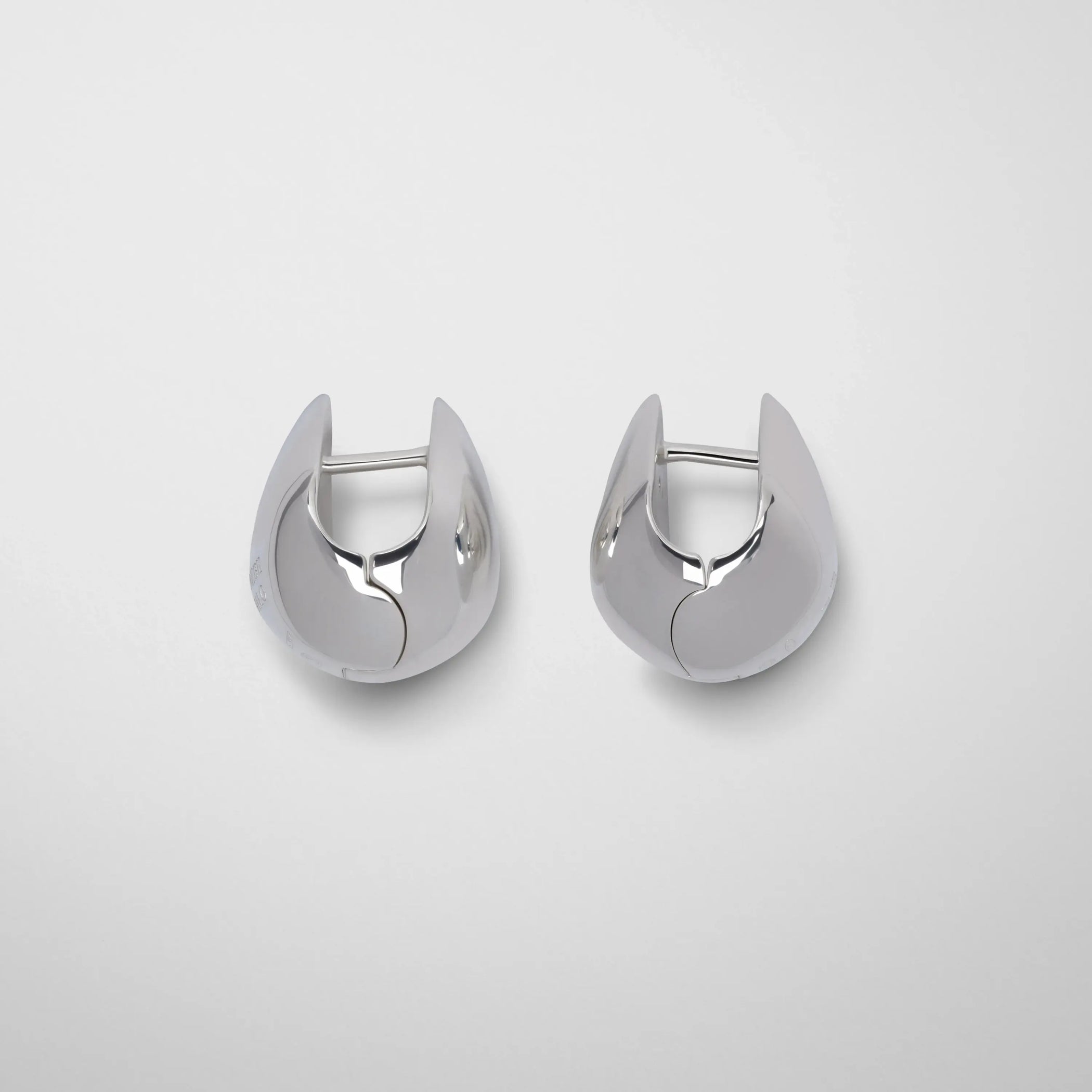 Side view of pebble stud earrings in sterling silver