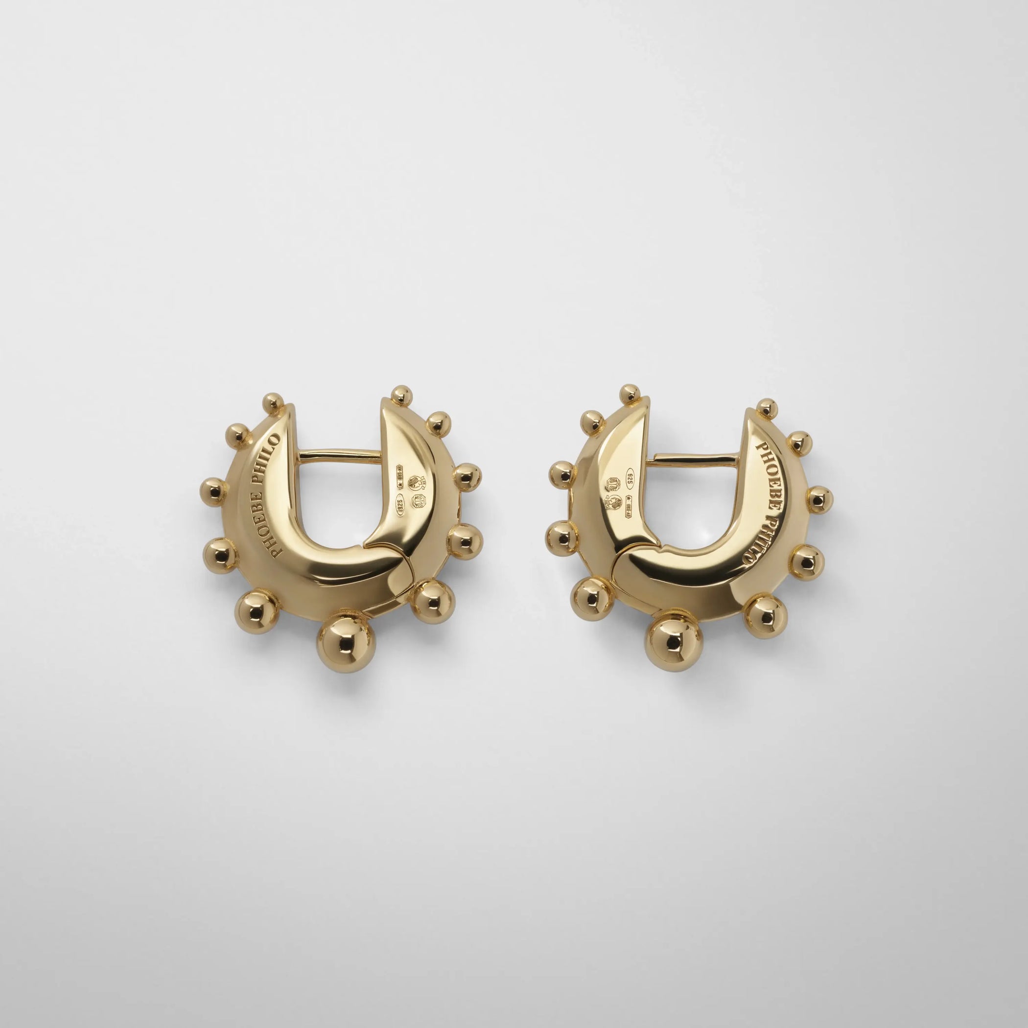 Flat back view of beaded hoop earrings small in gold plated sterling silver.