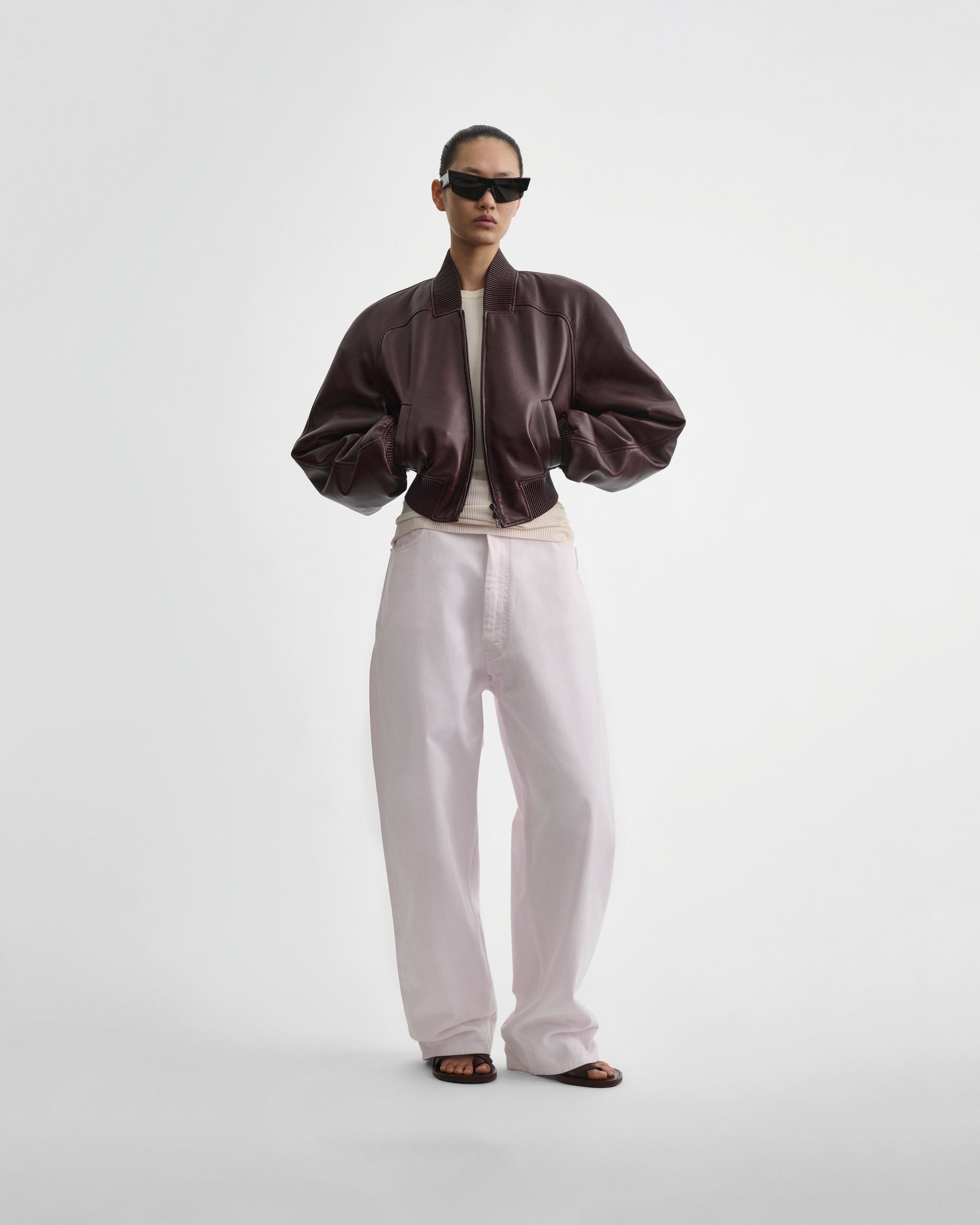 Full length front view of model wearing DROP JEANS in pale pink pink