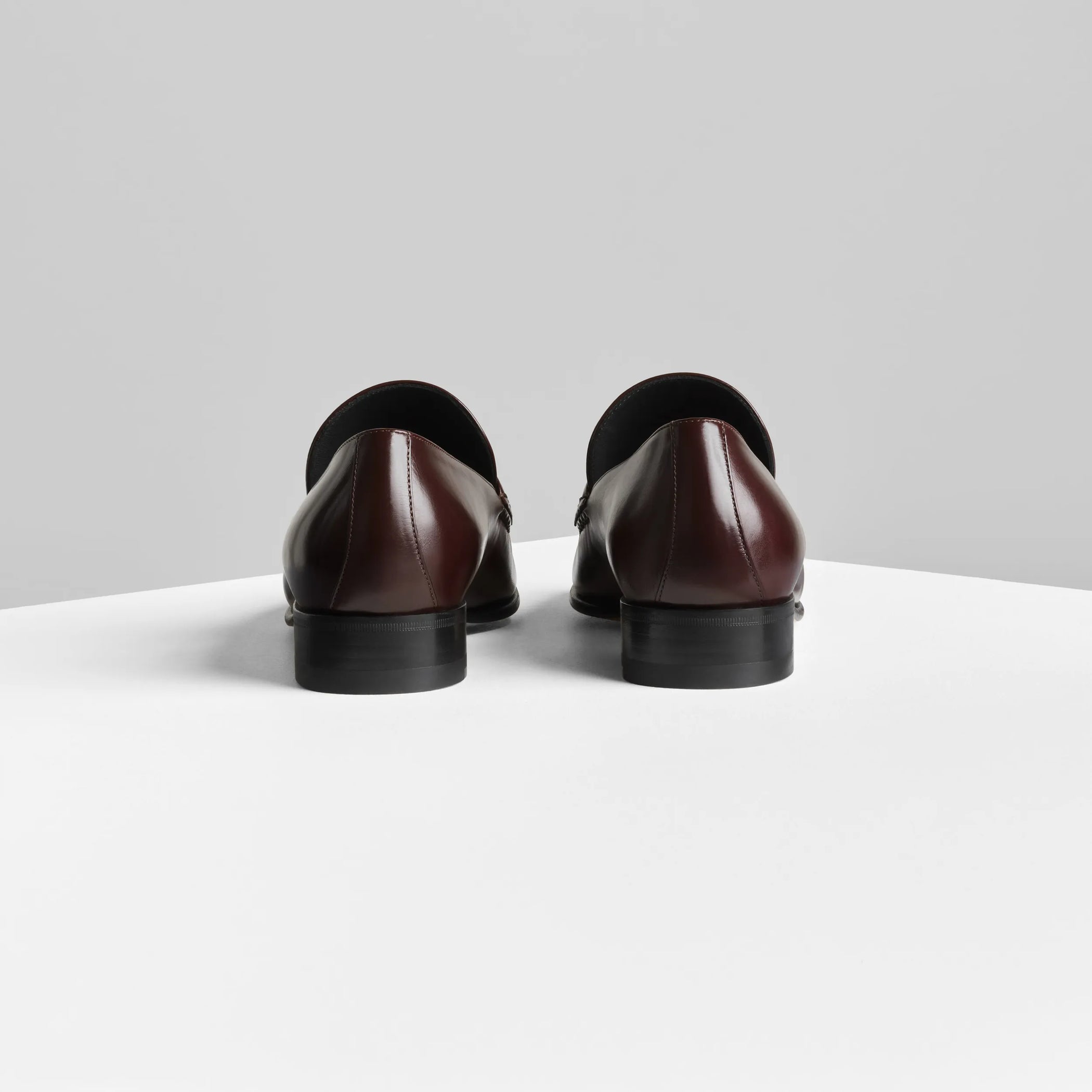 Back view of man&#39;s loafer in oxblood leather