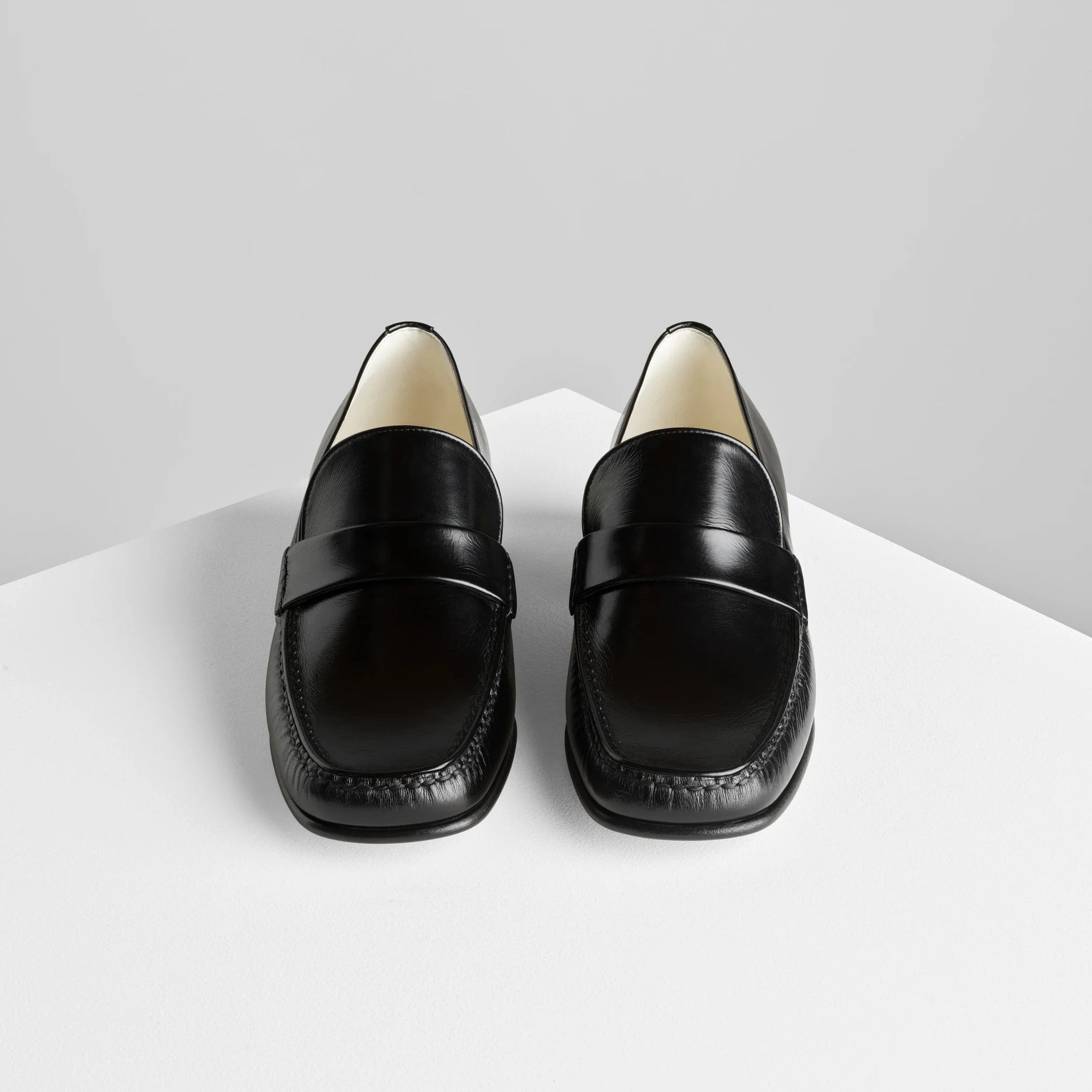 Front view of man’s loafer in black leather.