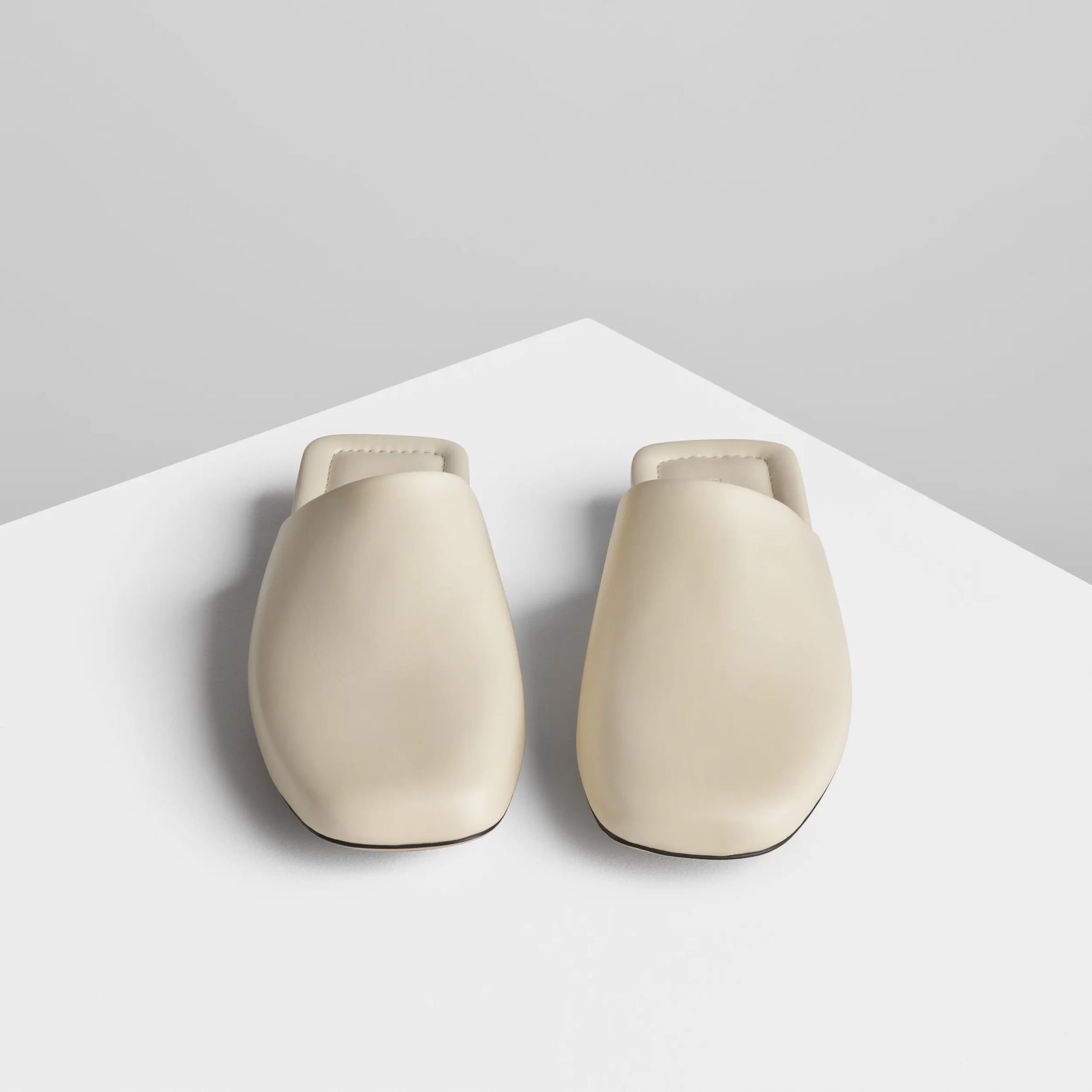 Front view of robe slide in cream leather.