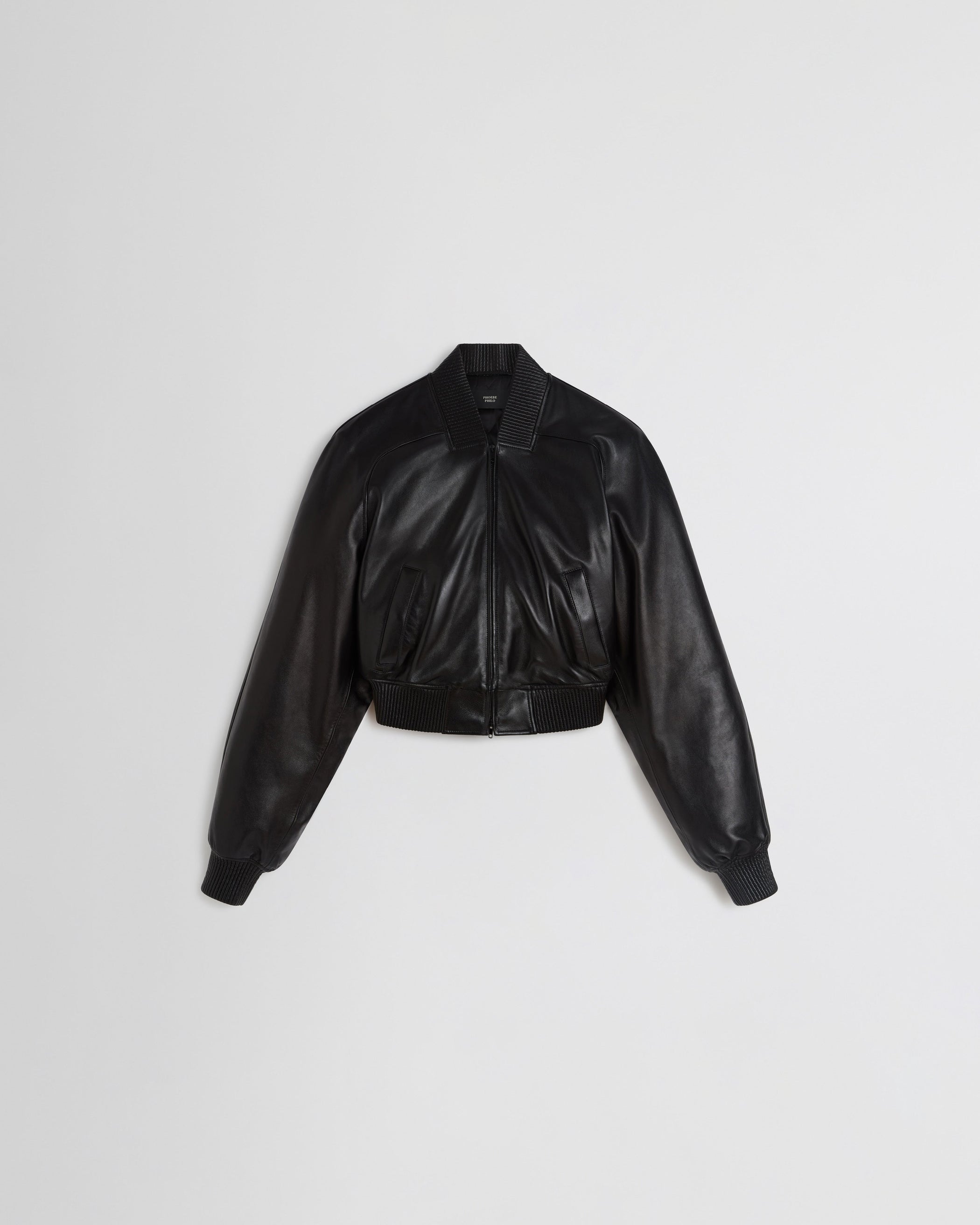 Flat front view of SHRUNK BOMBER in black leather