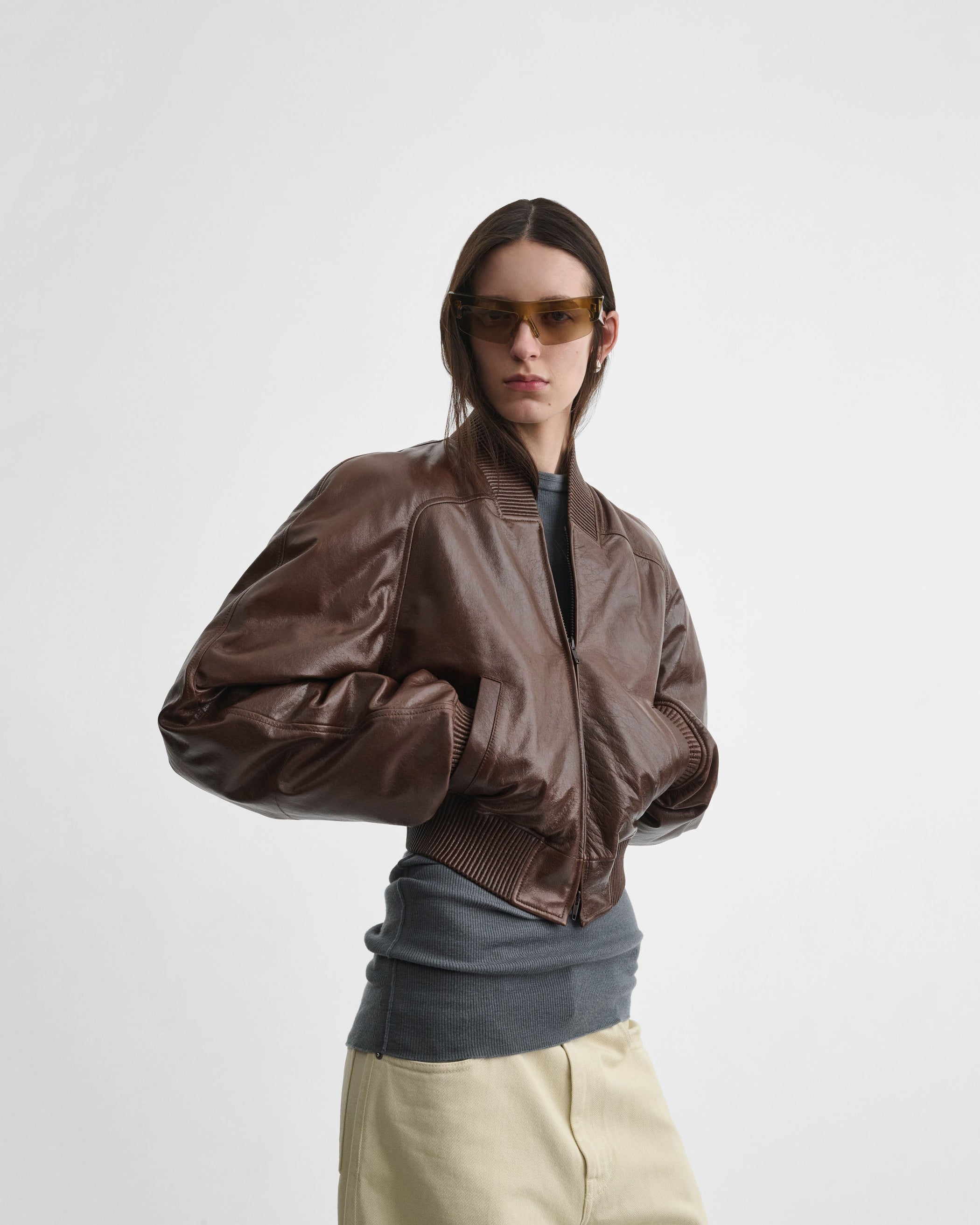 Front view of model wearing SHRUNK BOMBER in tobacco leather