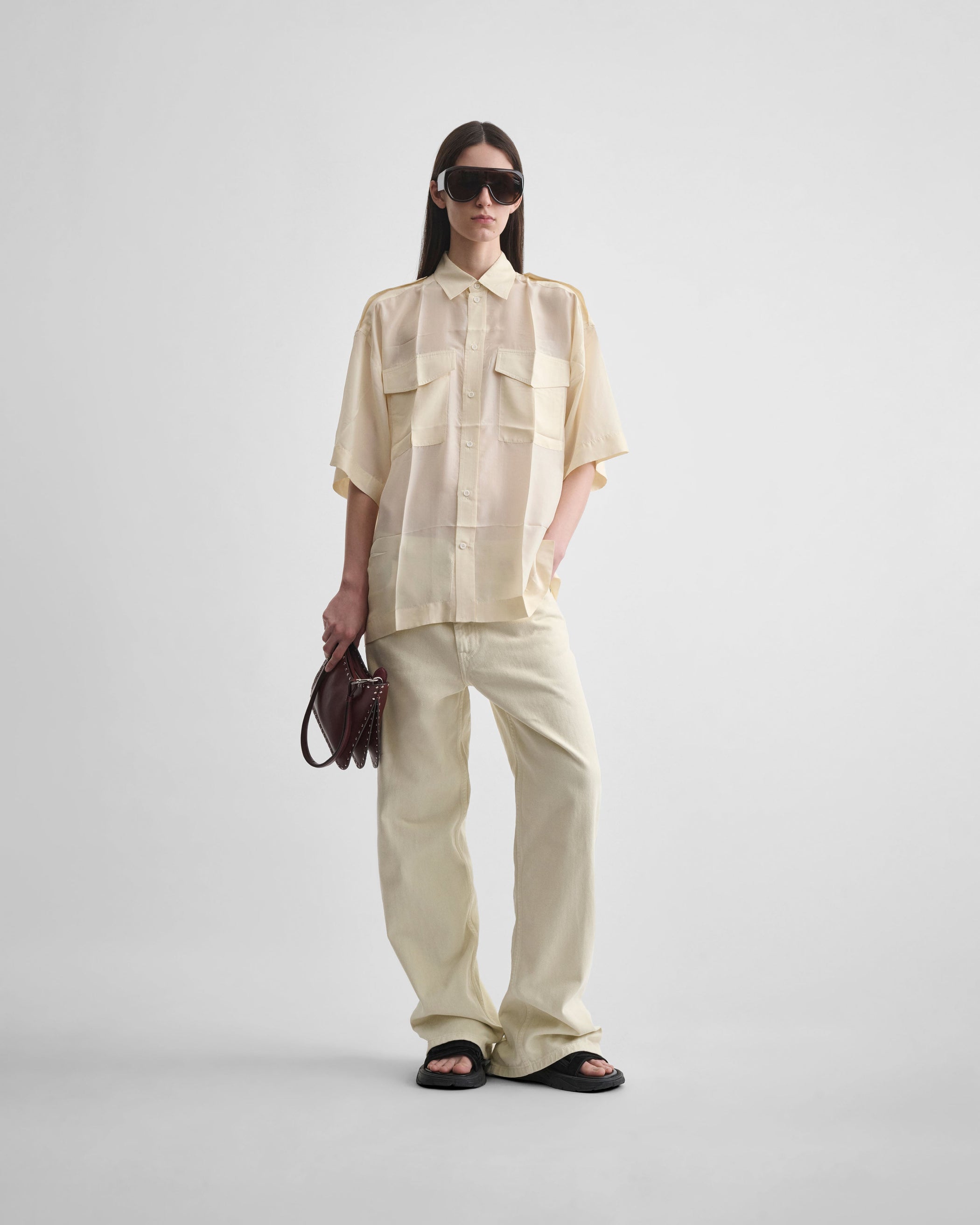 Full length front view of model wearing ZIP JEANS in pistachio cotton