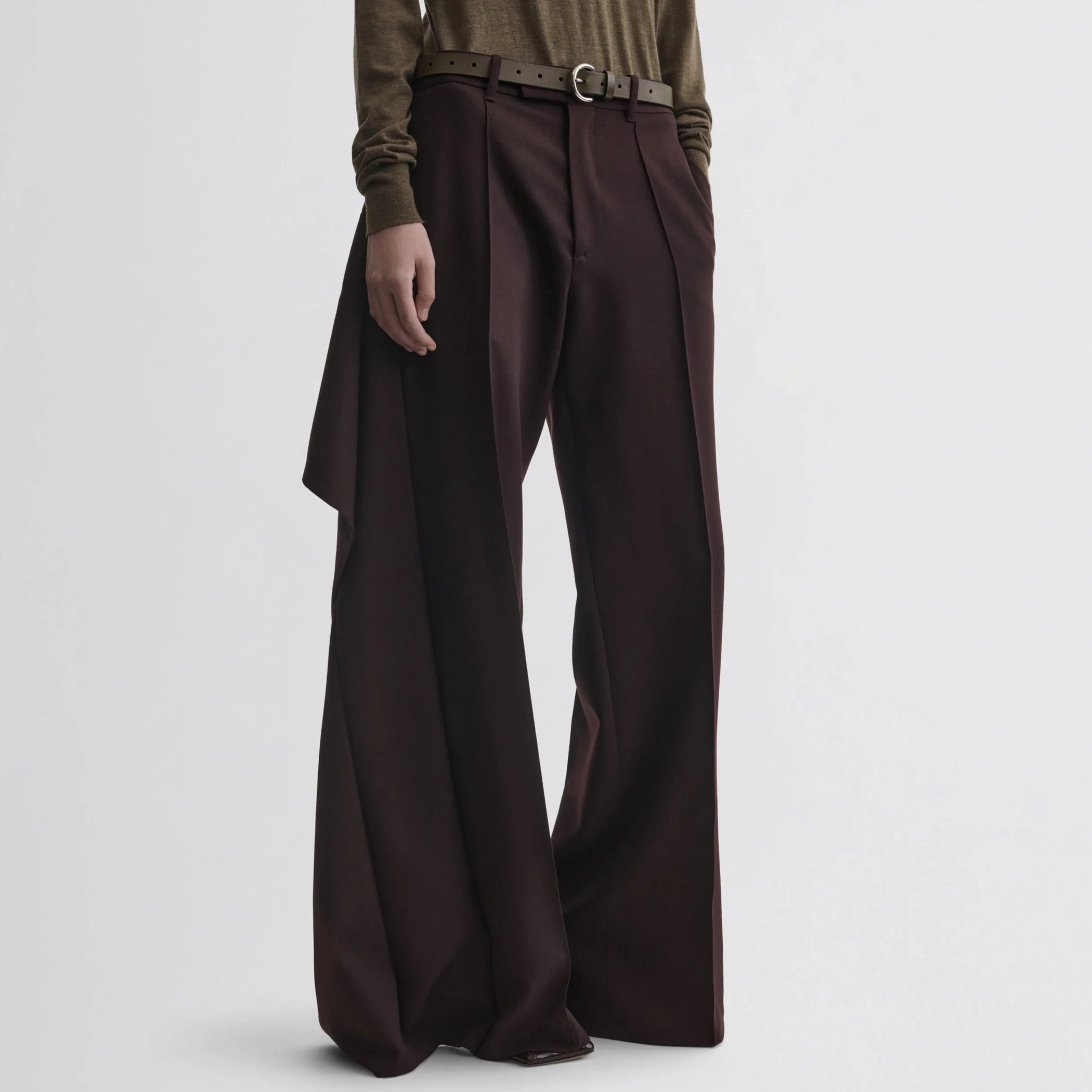 Front view of model wearing apron trousers in chocolate wool.