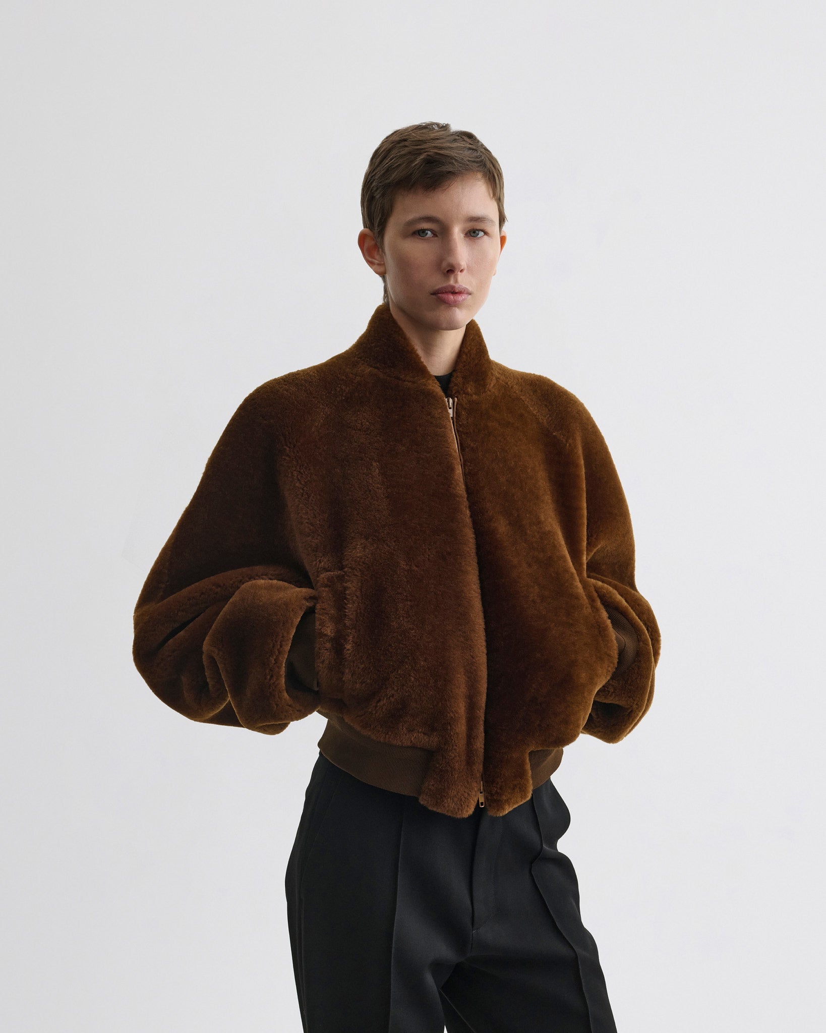 Front view of model wearing Super Soft Bomber Jacket in ginger shearling