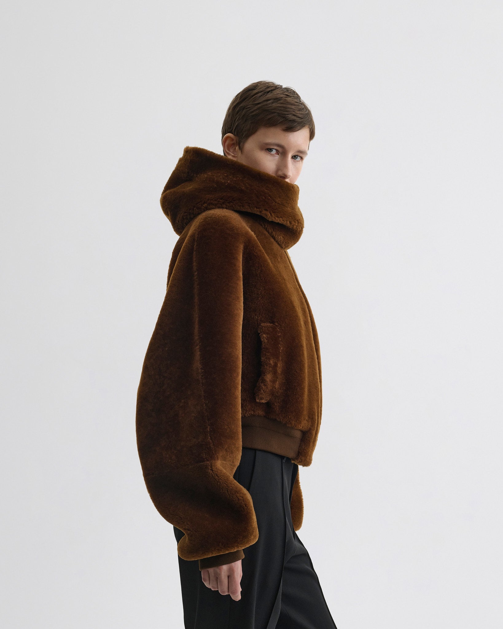 Side view of model wearing Super Soft Bomber Jacket in ginger shearling