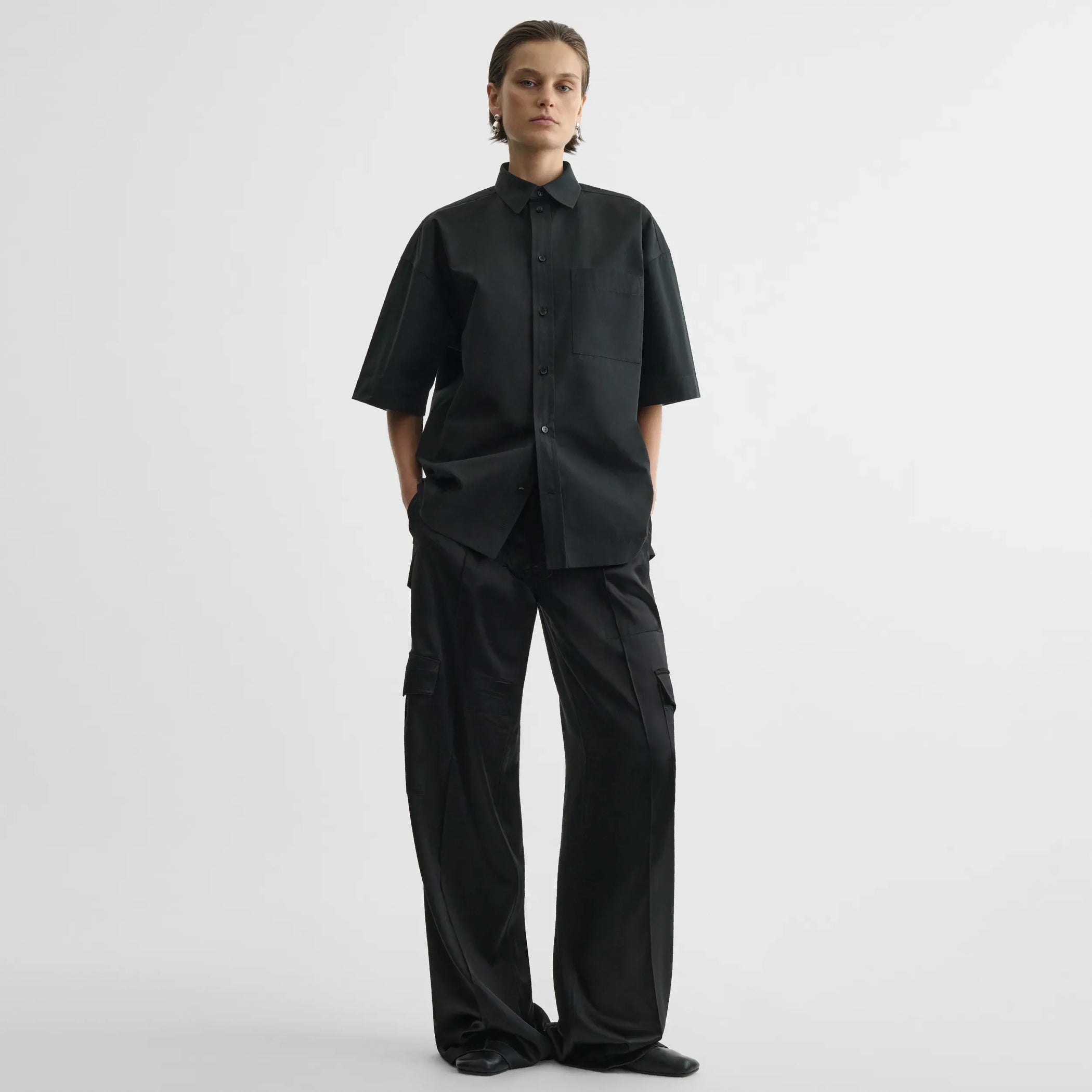 Front view of short sleeve shirt in black cotton