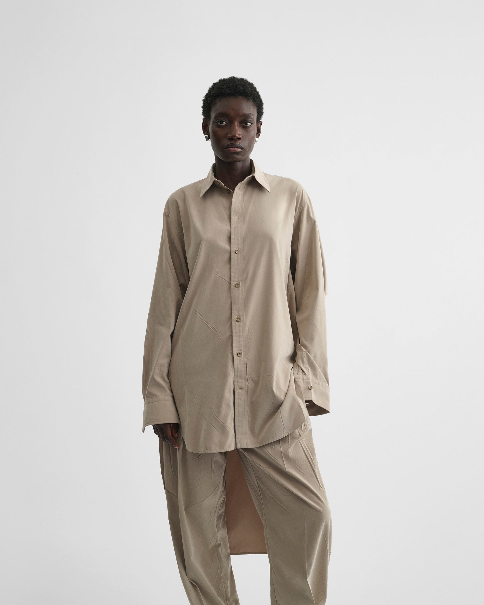 View of elongated shirt in trench poly-twill