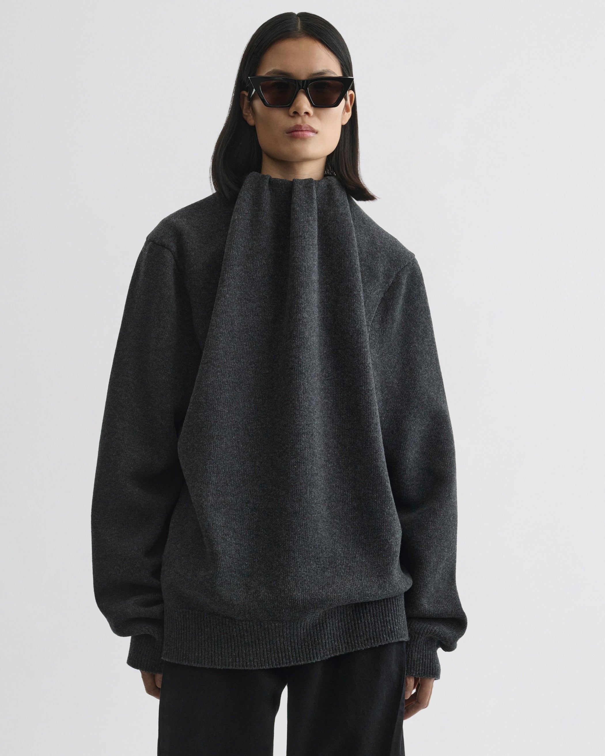 Front view of model wearing SOFT RIDGE JUMPER in grey melange wool