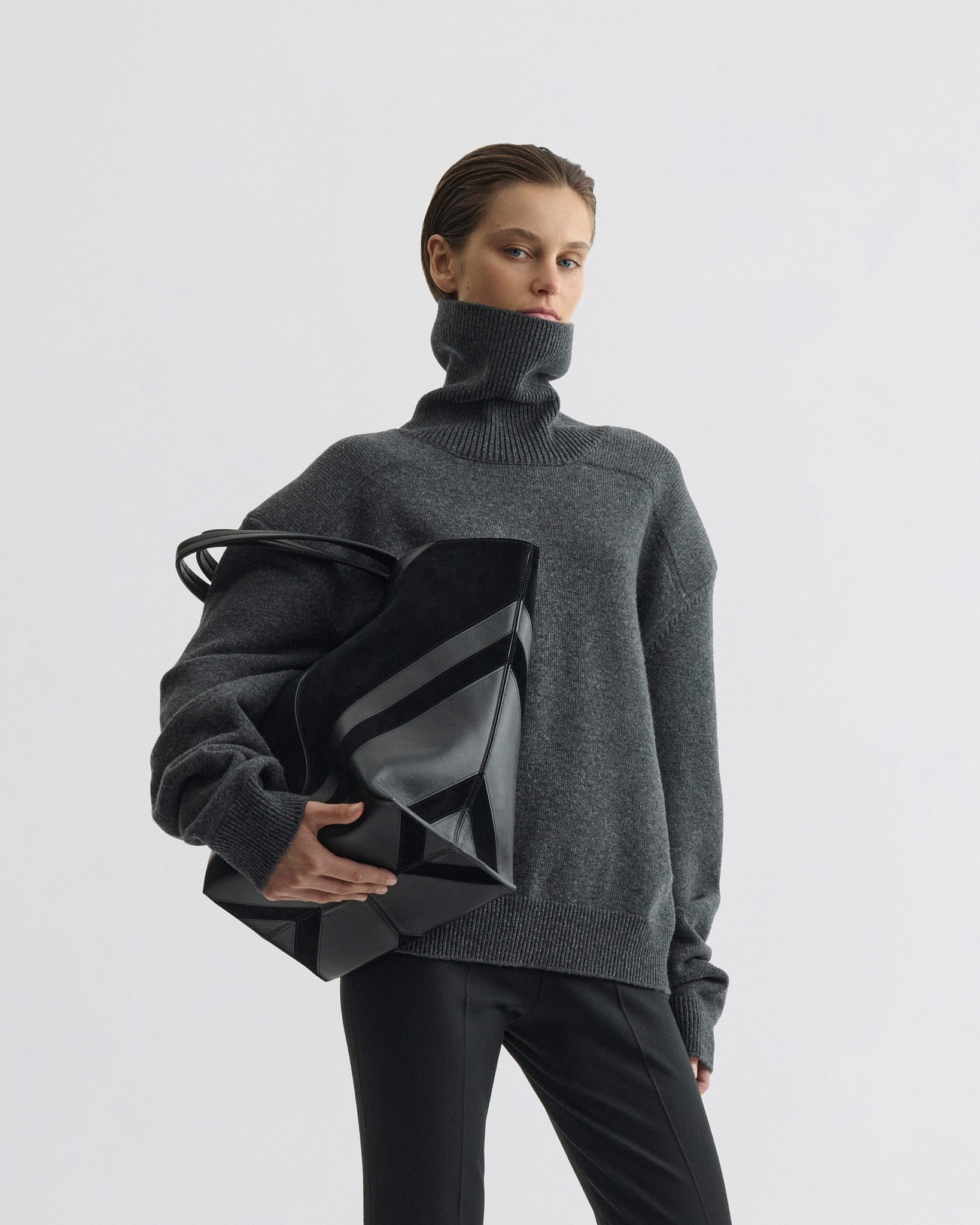 Front view of model wearing Patch Shoulder Jumper in grey melange wool cashmere