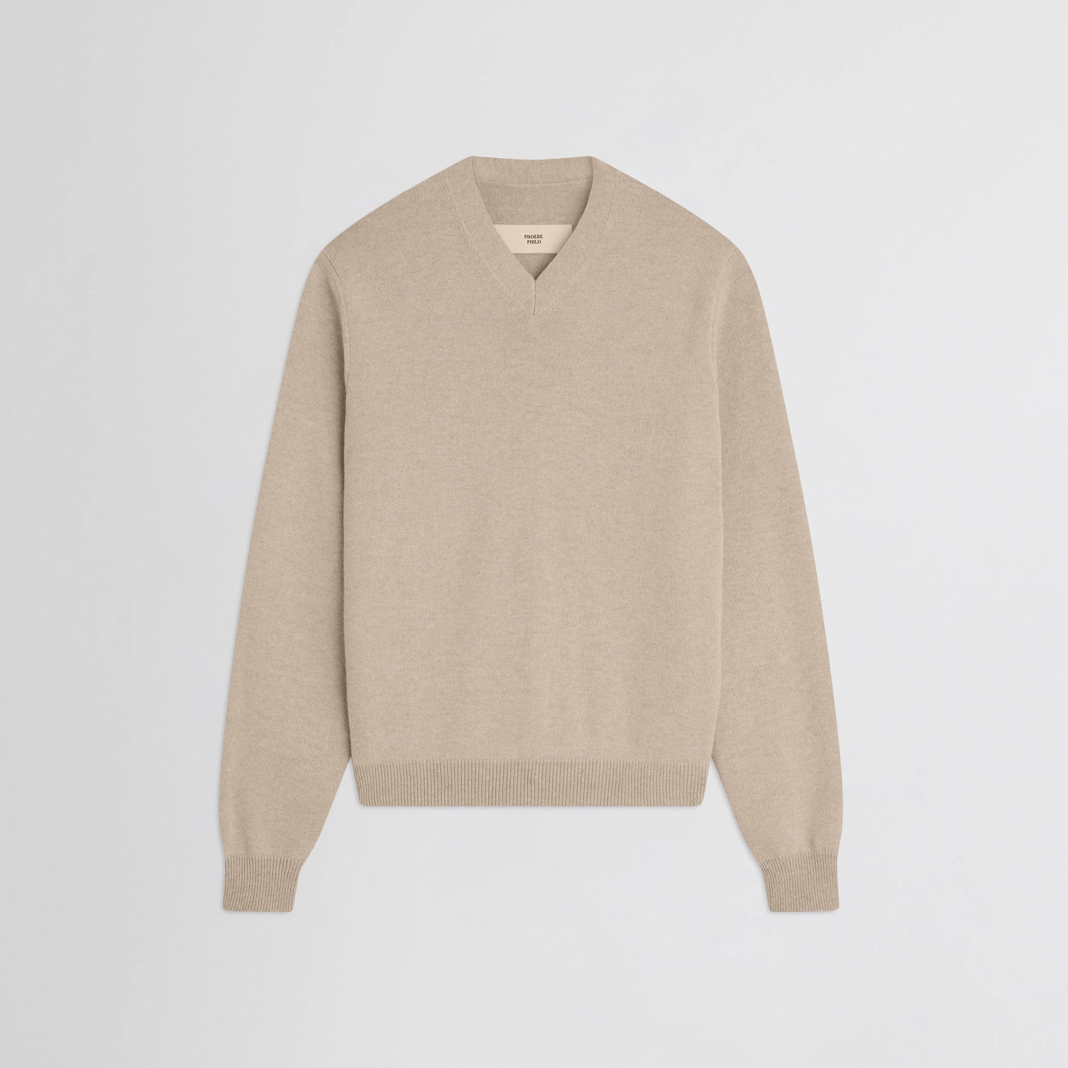 Flat front view of easy v-neck sweater in beige wool cashmere.