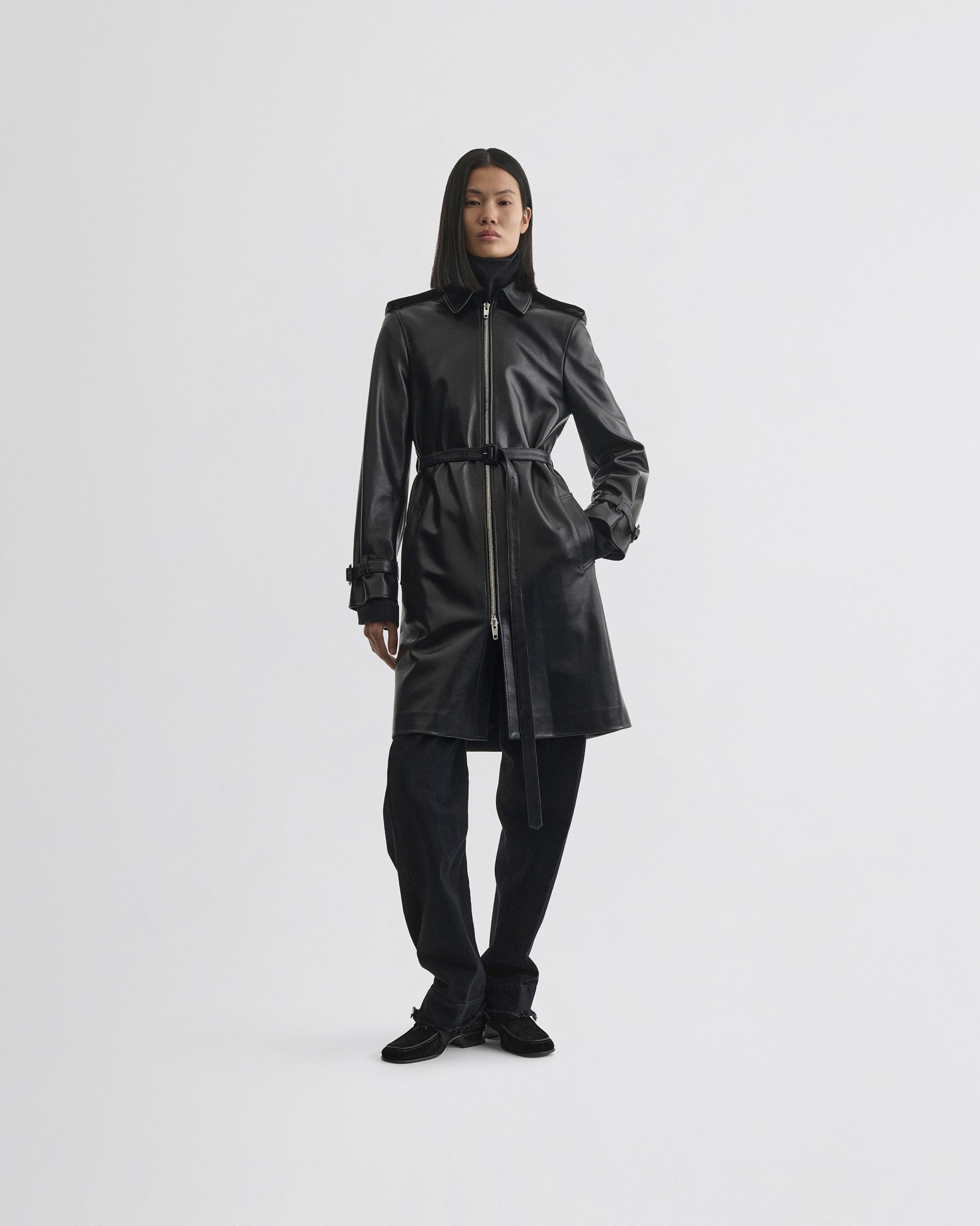 Front view of model wearing Short Trench in black leather