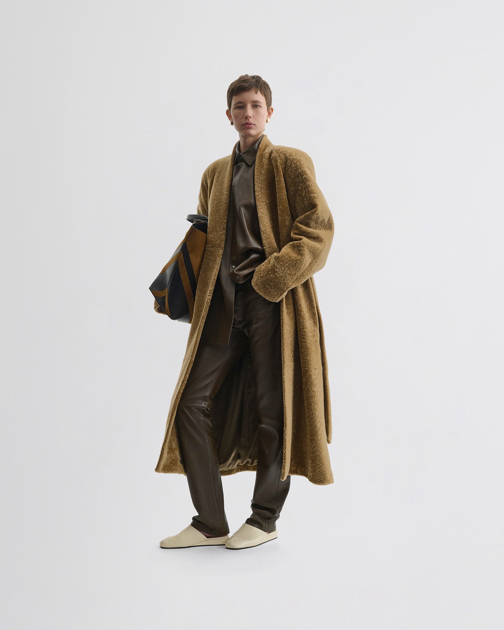 Front view of model wearing Shaved Robe Coat in tabac shearling