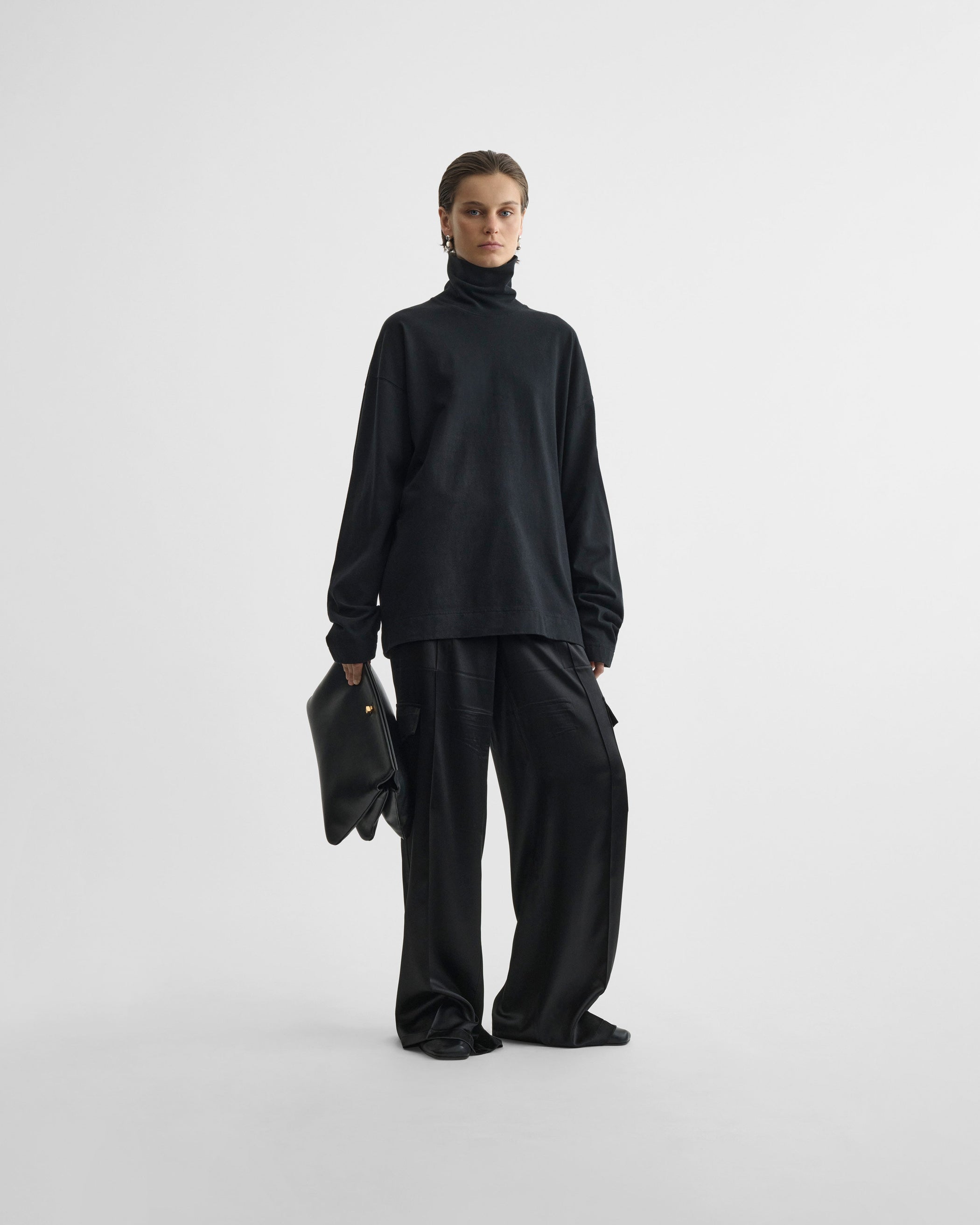 View of liquid cargo trousers in black silk
