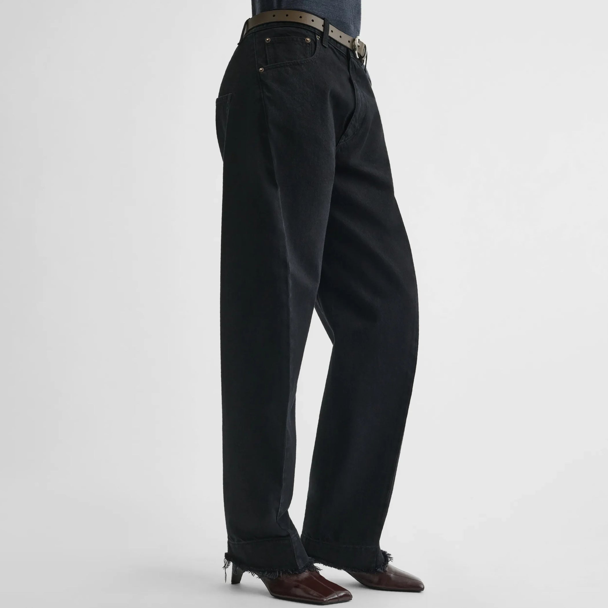 Side view of arch jeans in black cotton
