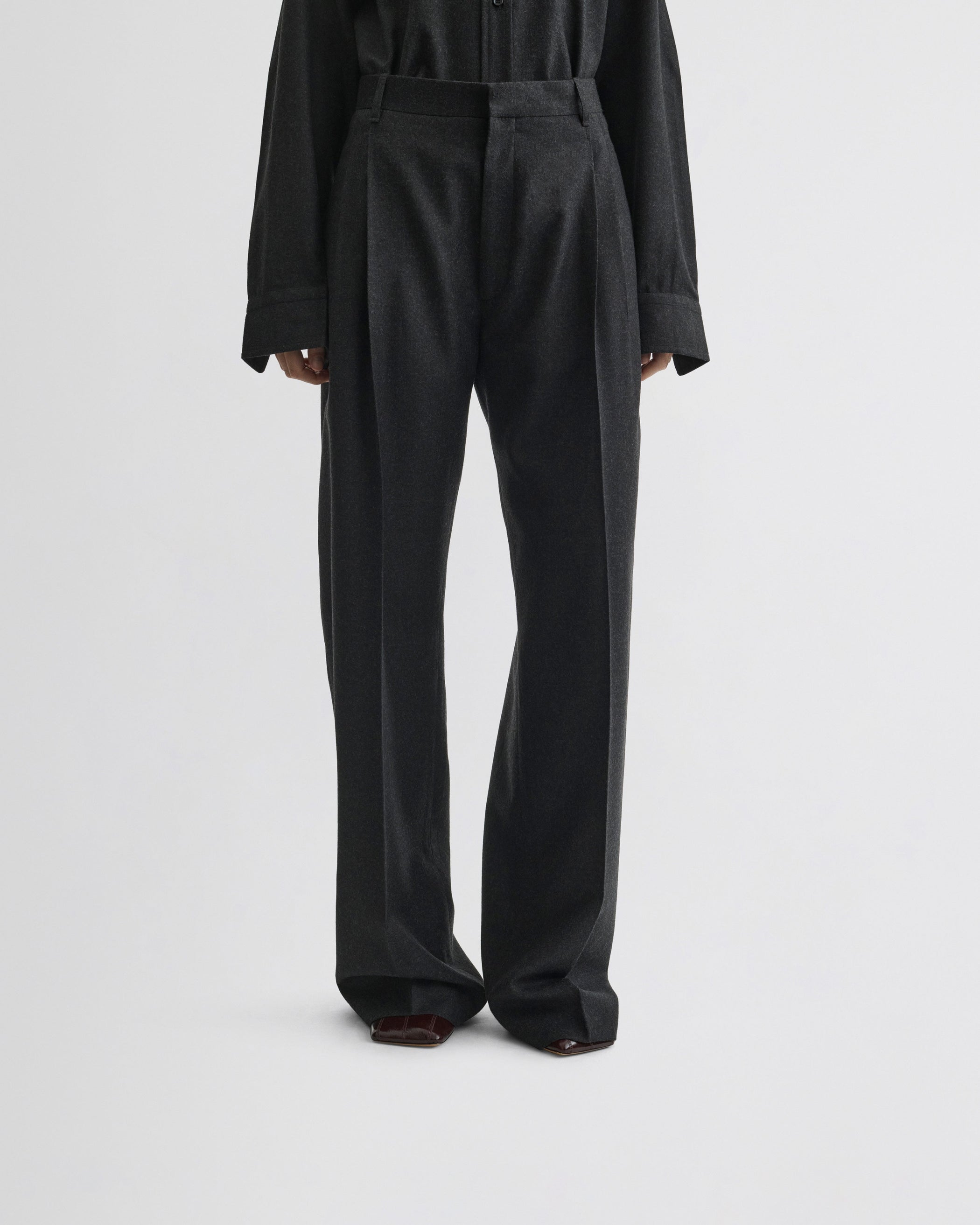 View of double pleat trousers in charcoal wool