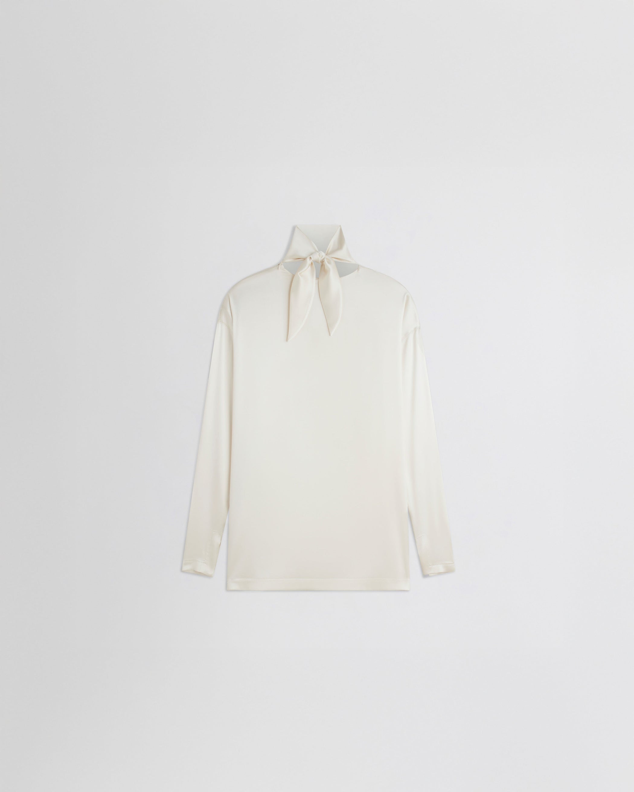 Flat back view of LIQUID KNOT COLLAR TOP in cream silk