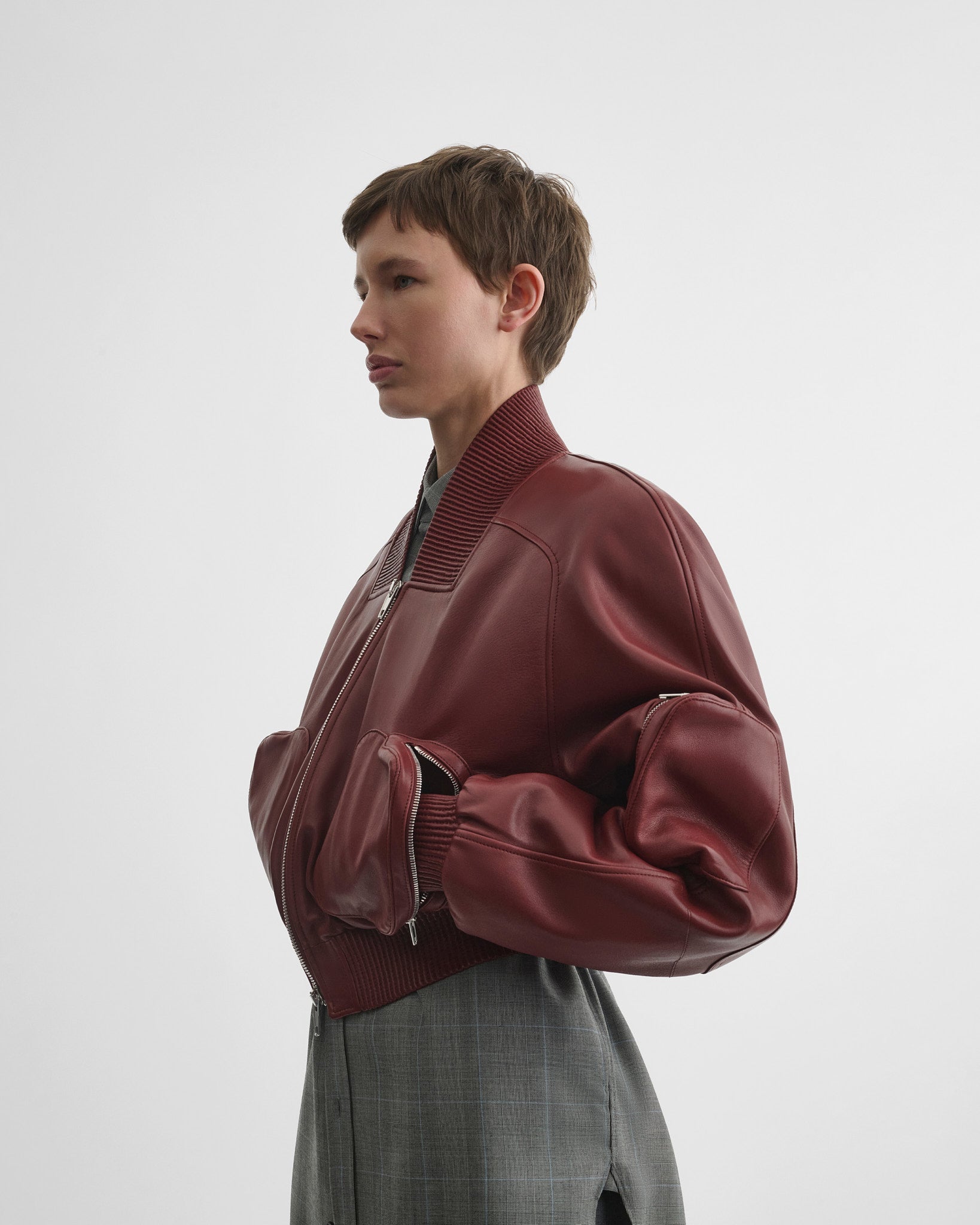 Side view of pocket bomber jacket in brick leather