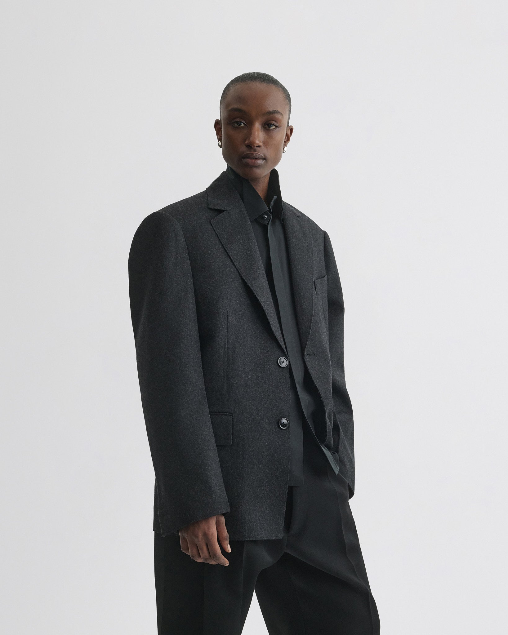 Front view of model wearing Tuxedo Jacket in anthracite wool