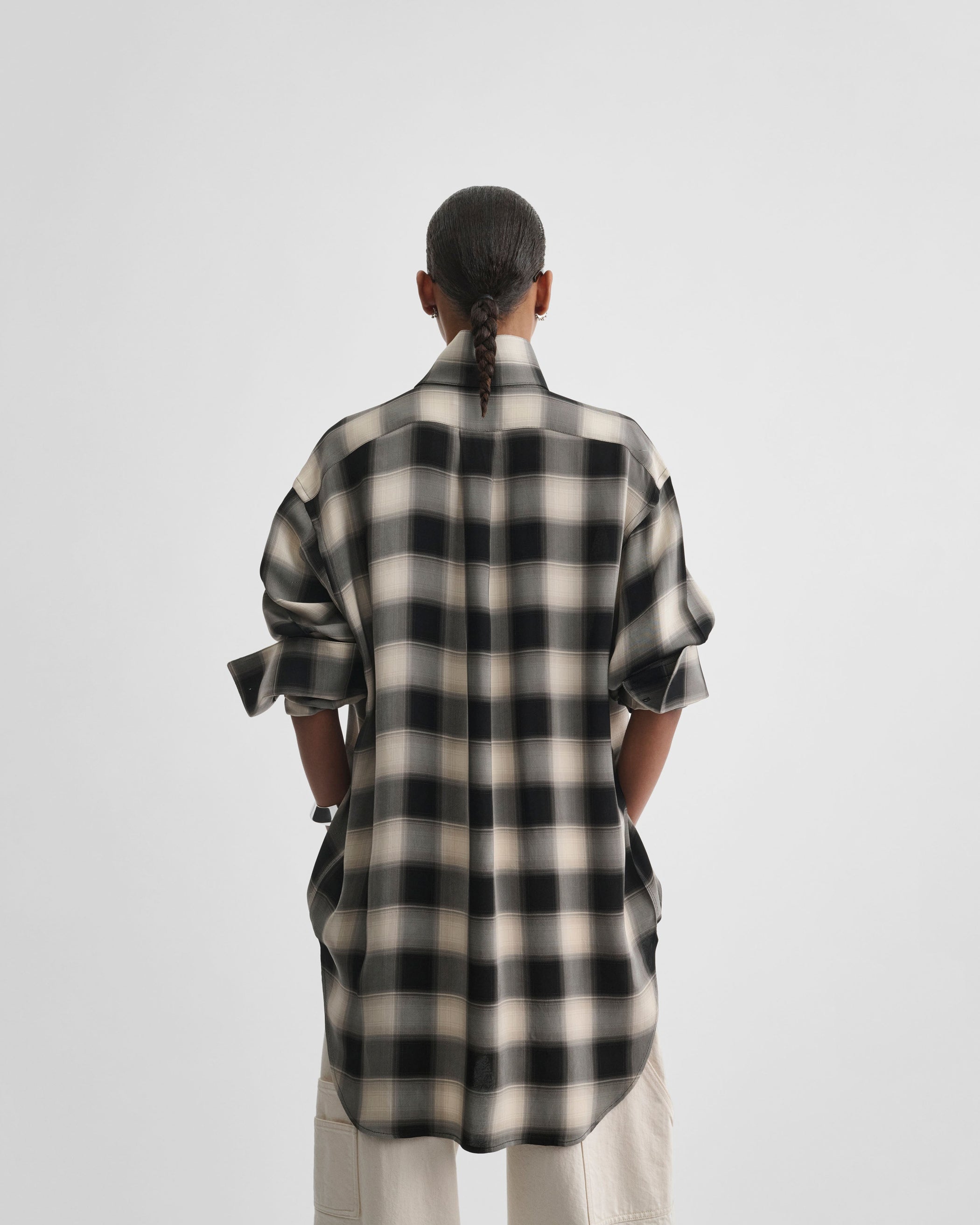 Back view of model wearing CUSTOM TUX SHIRT in b/b check viscose