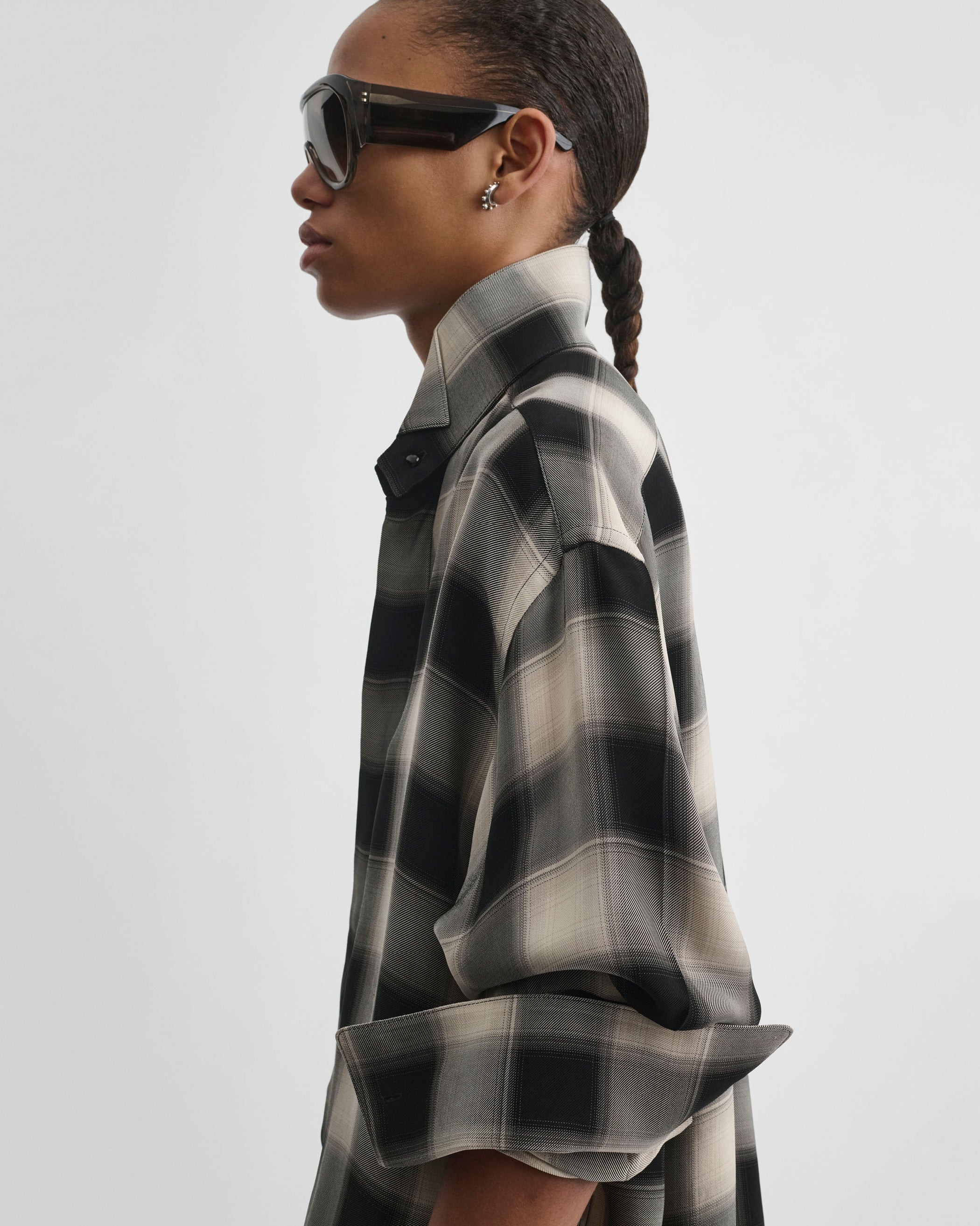 Side view of model wearing CUSTOM TUX SHIRT in b/b check viscose