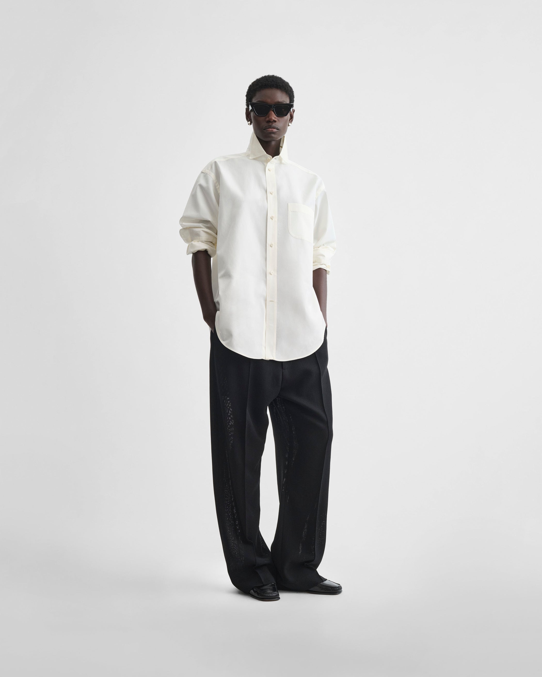 Front view of model wearing CLASSIC SHIRT in cream cotton