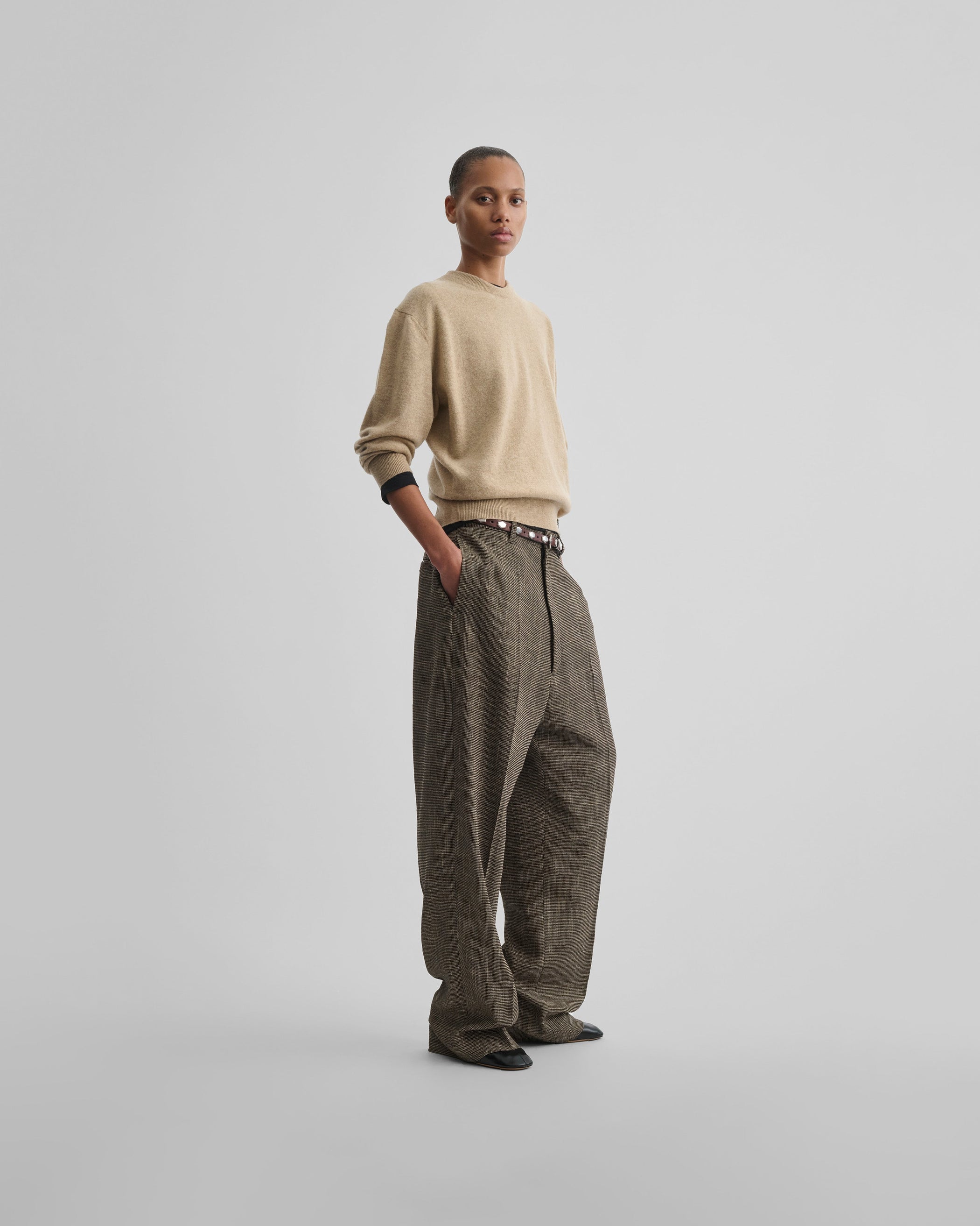 Angled front view of model wearing CLASSIC CREW NECK in oatmeal wool