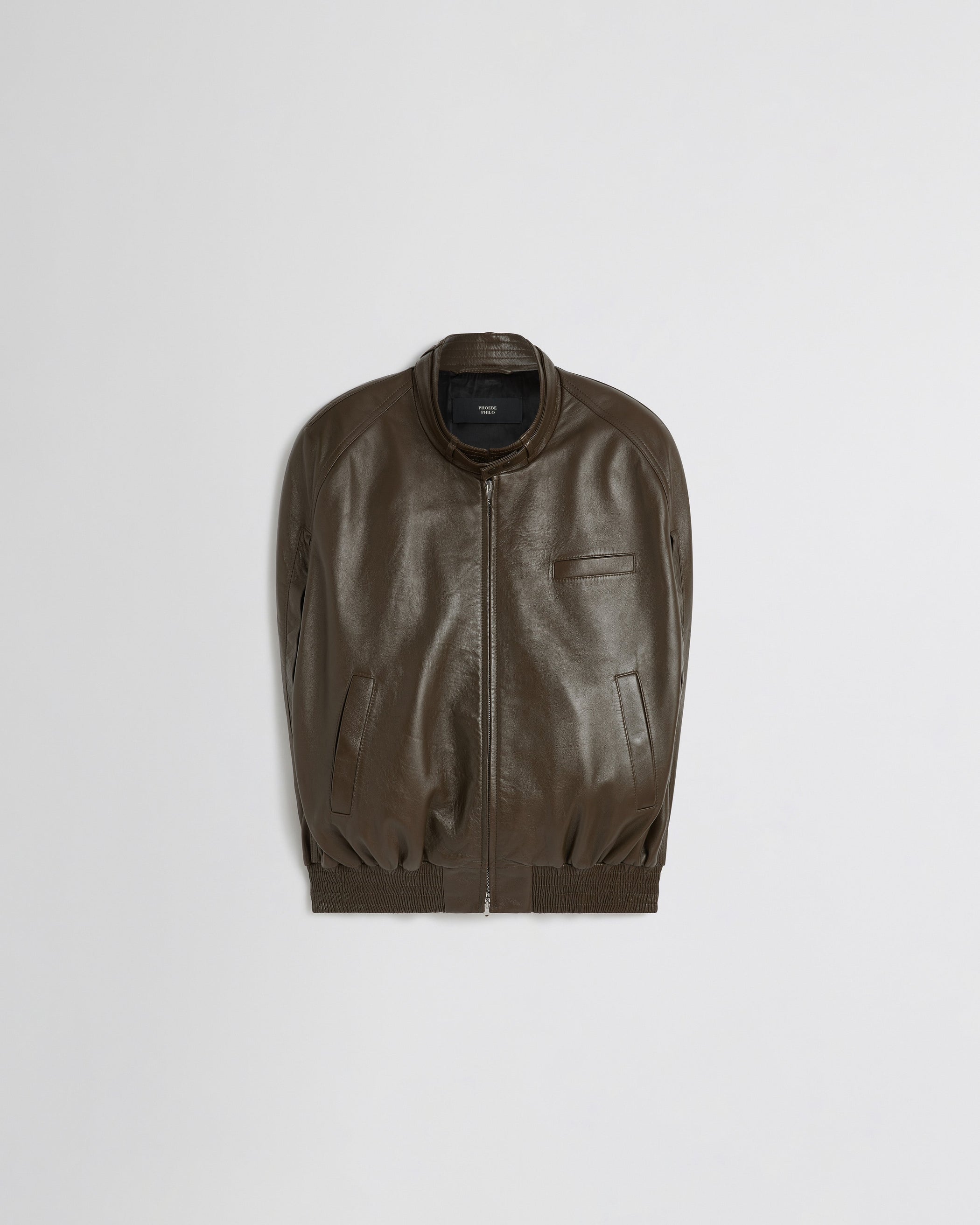 Flat front view of CAPE BOMBER in green bronze leather