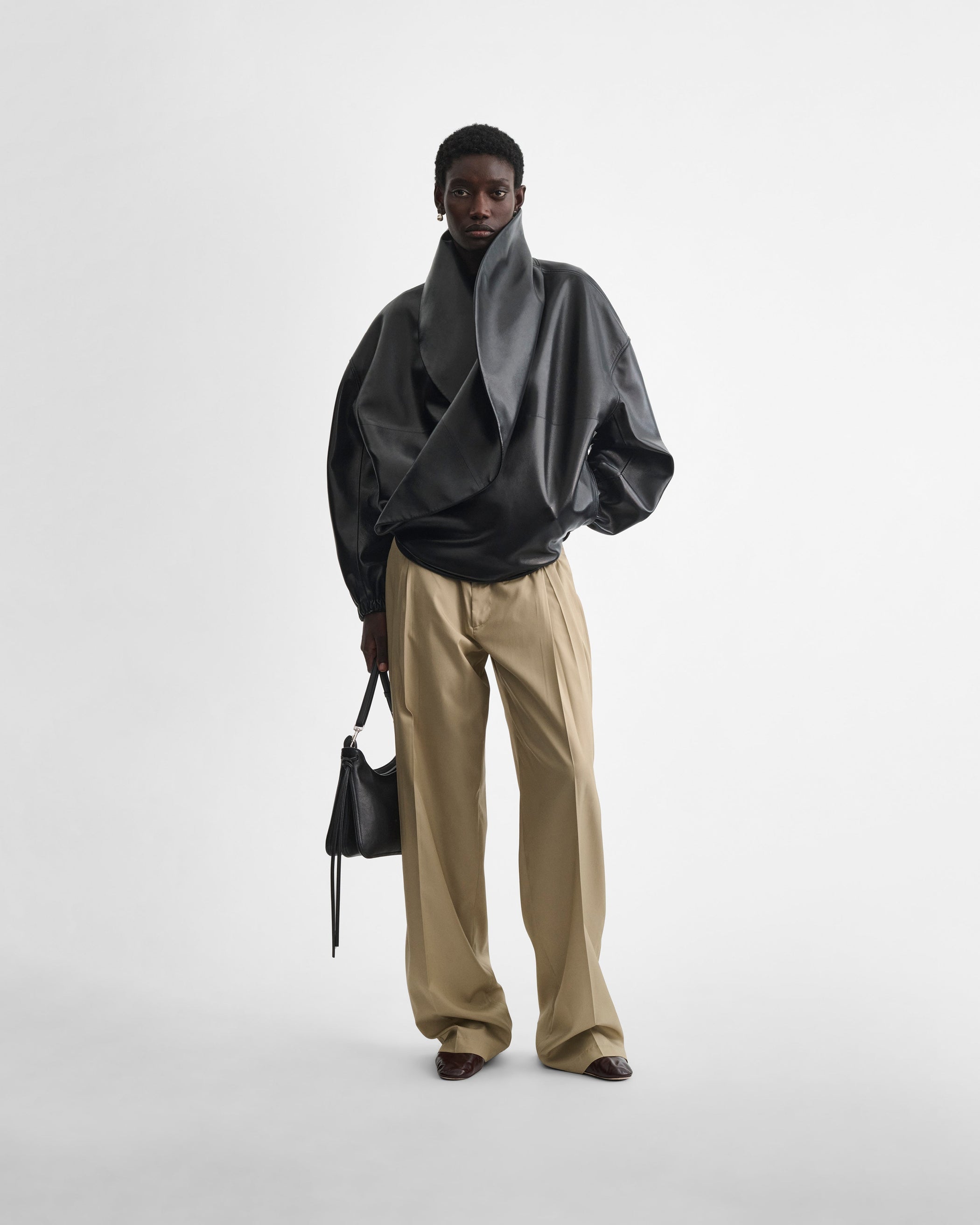 Front view of model wearing the MOON BOMBER in black leather